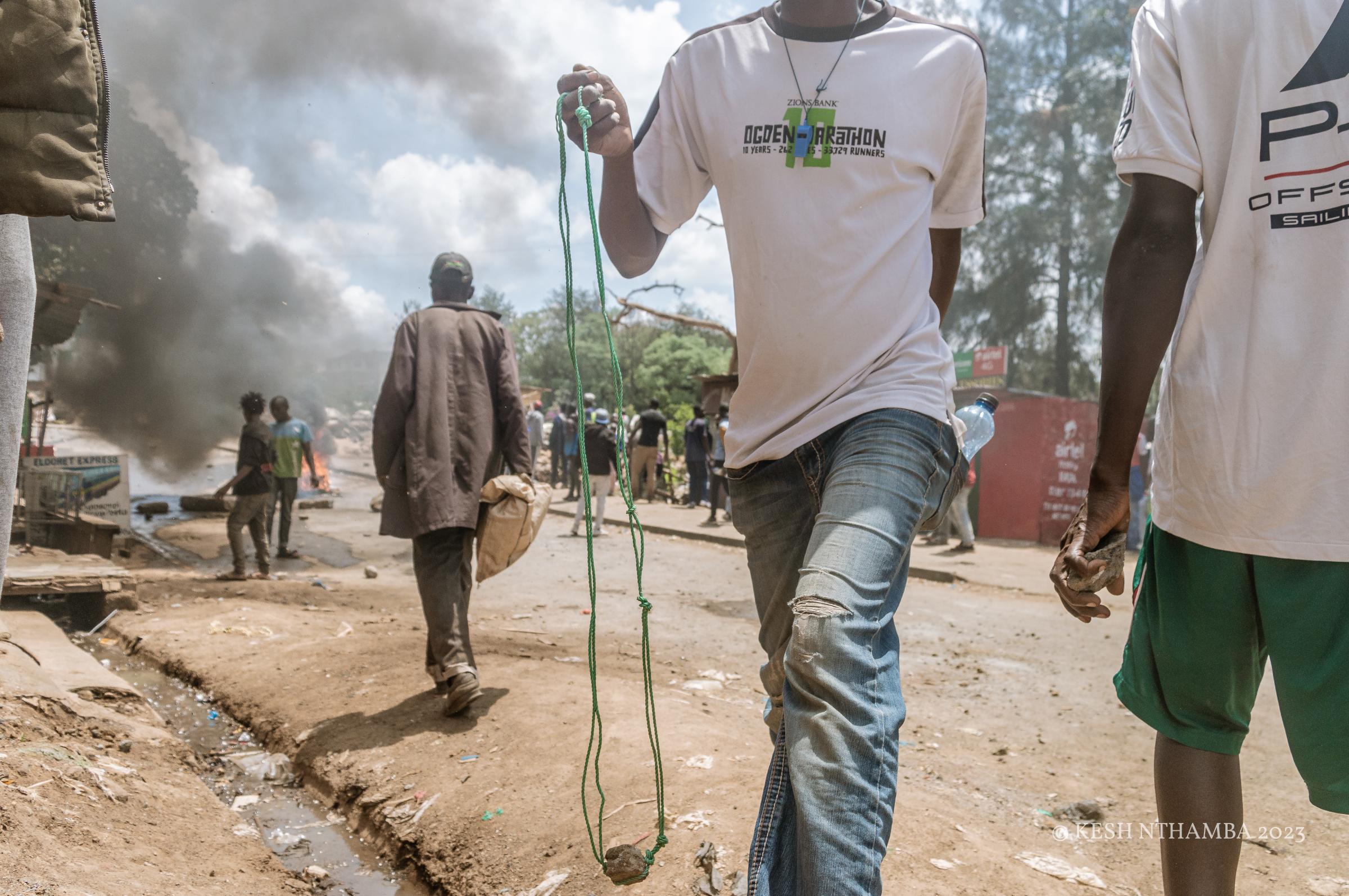 Anti-government Kibera Protests - A protestor carrys a sling during the anti-government...