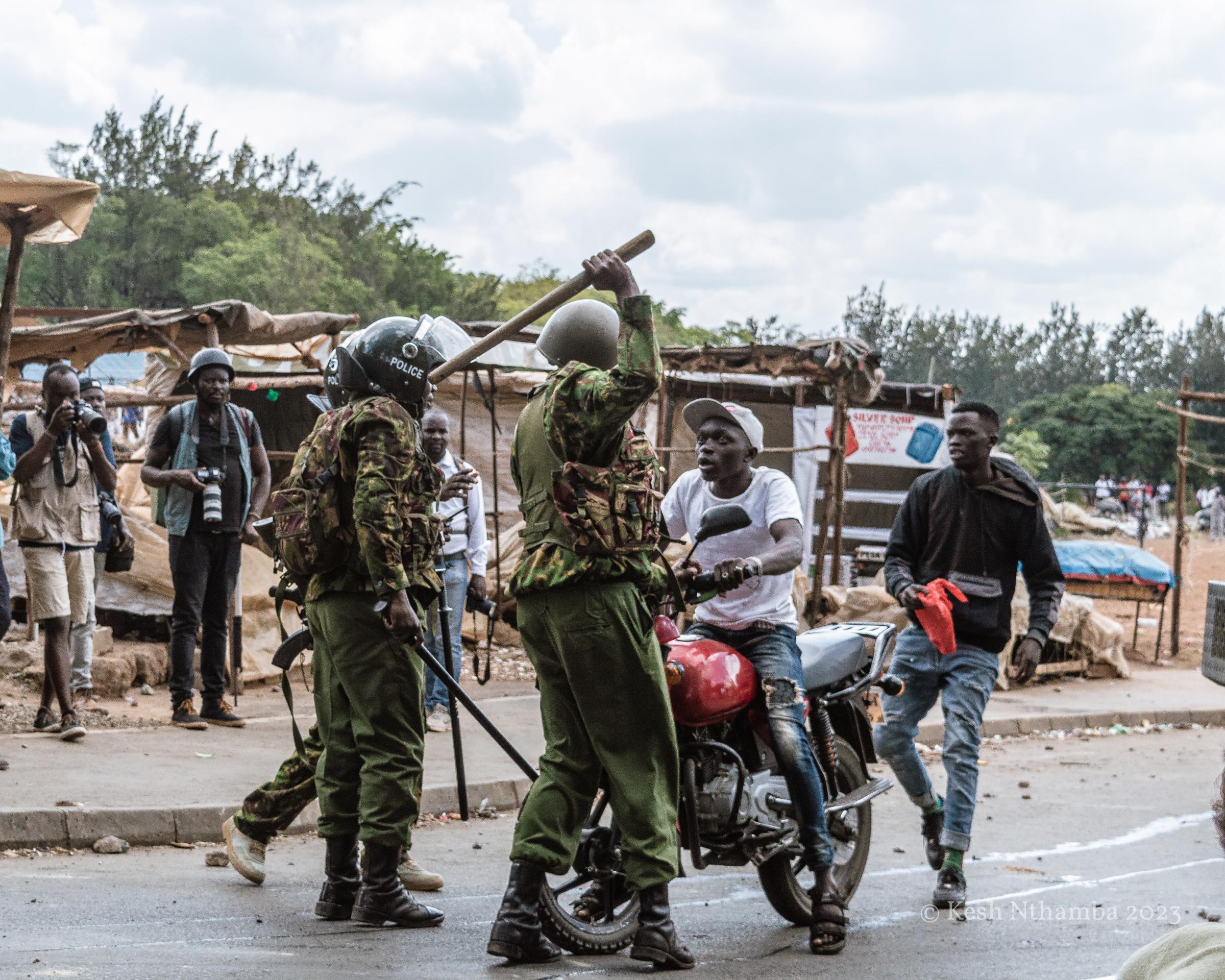 Anti-government Kibera Protests - A motorcycle operator is denied exit from Kibera during...