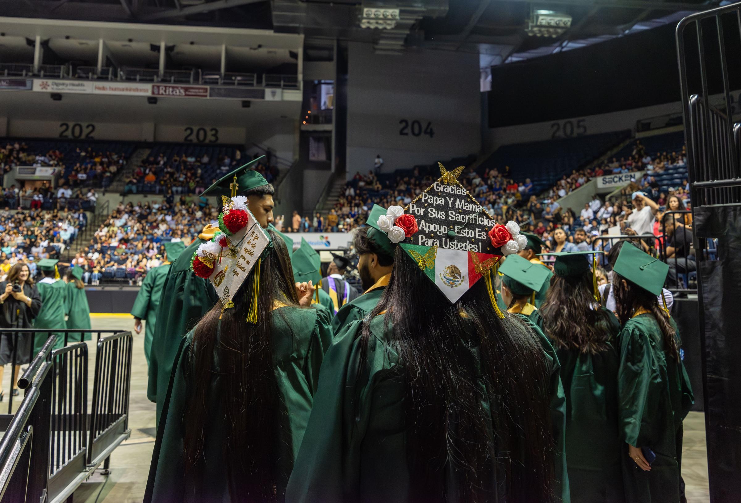 Graduation, at last (Photos for CalMatters) - Franklin High School students enter the arena as they get ready to graduate during Class of 2023...
