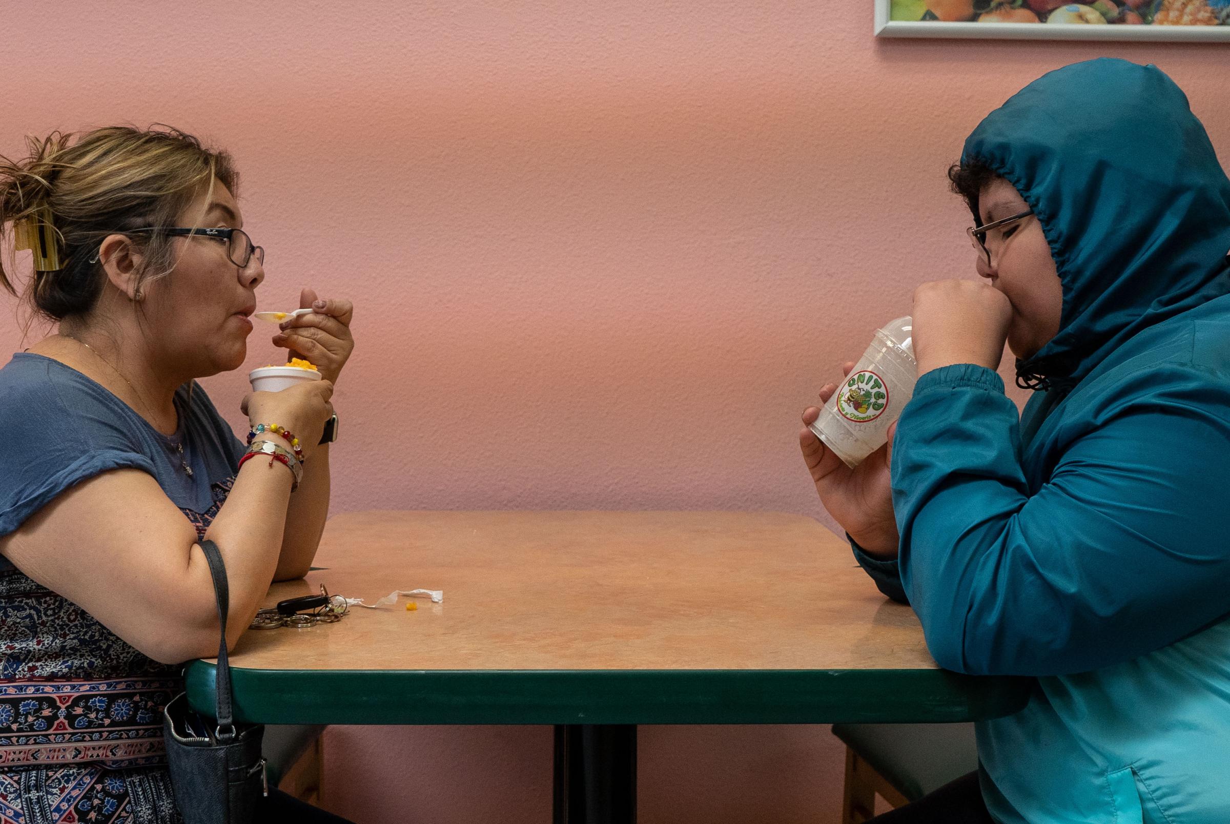 Lack of Translation Services for the Latino Community - Griselda Juarez eats ice cream with her son Derick...