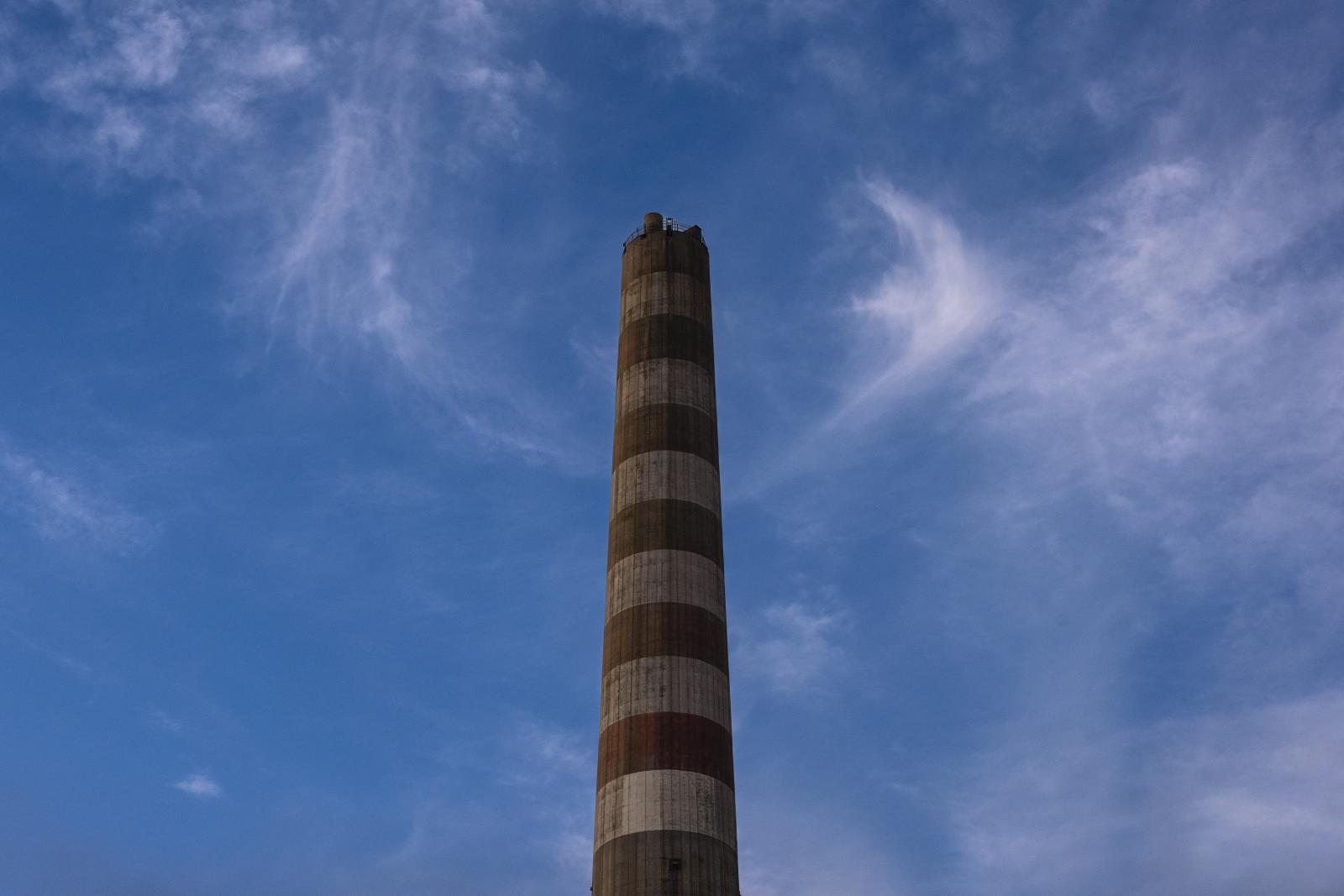 The refinery's chimney is inactive due to the high level of environmental pollution.  | Buy this image