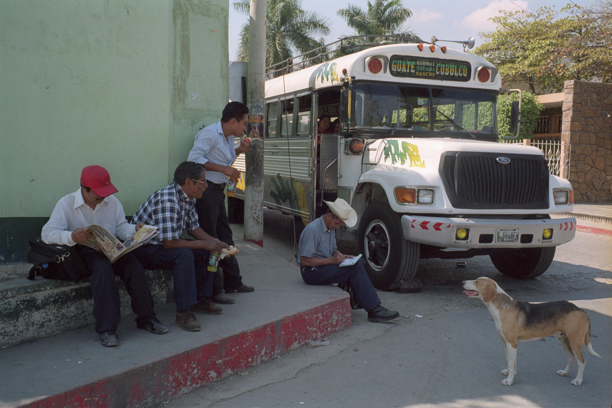 With God and Ayudante Across Guatemala - The driver of a bus and his ayudante (second and third...