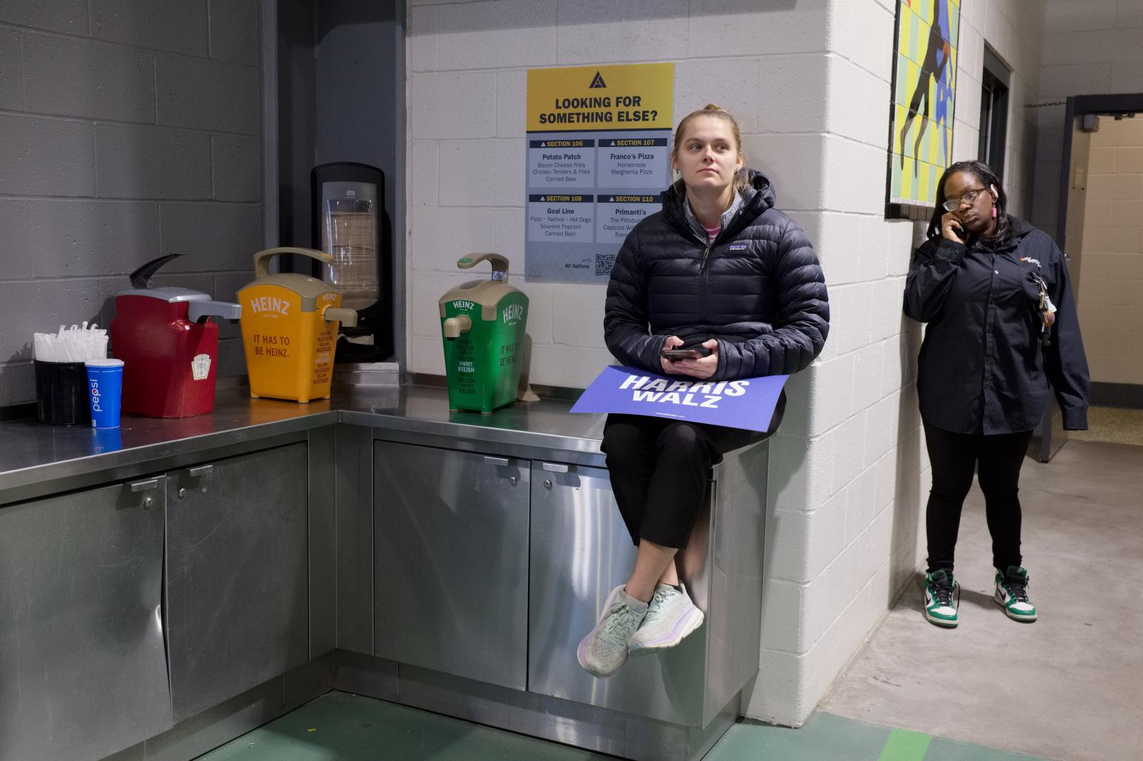 Women wait for Democratic vice-...-Walz campaign in Pennsylvania.