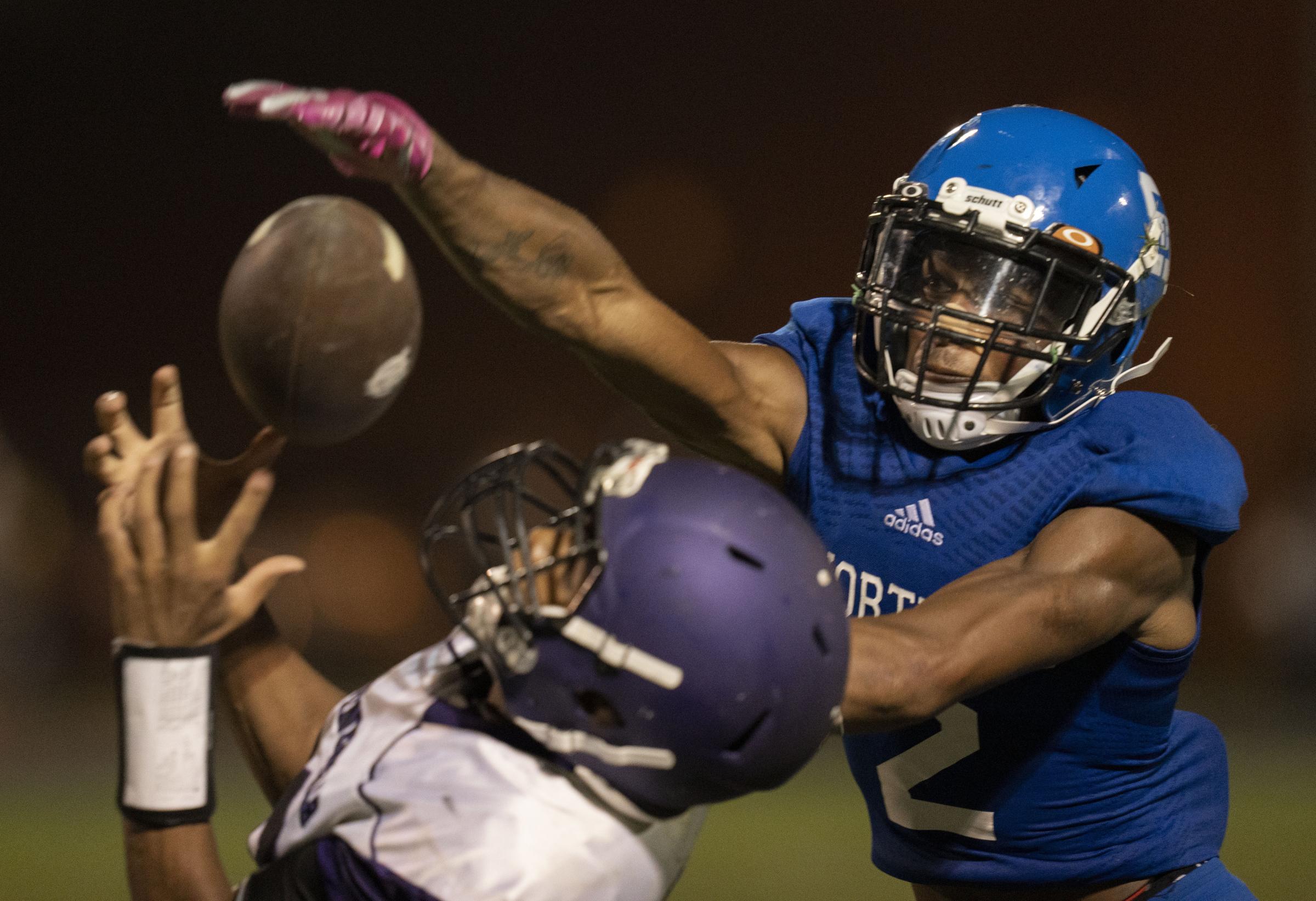 Sports - Nate Bateman of Shortridge, right, defends a pass against...