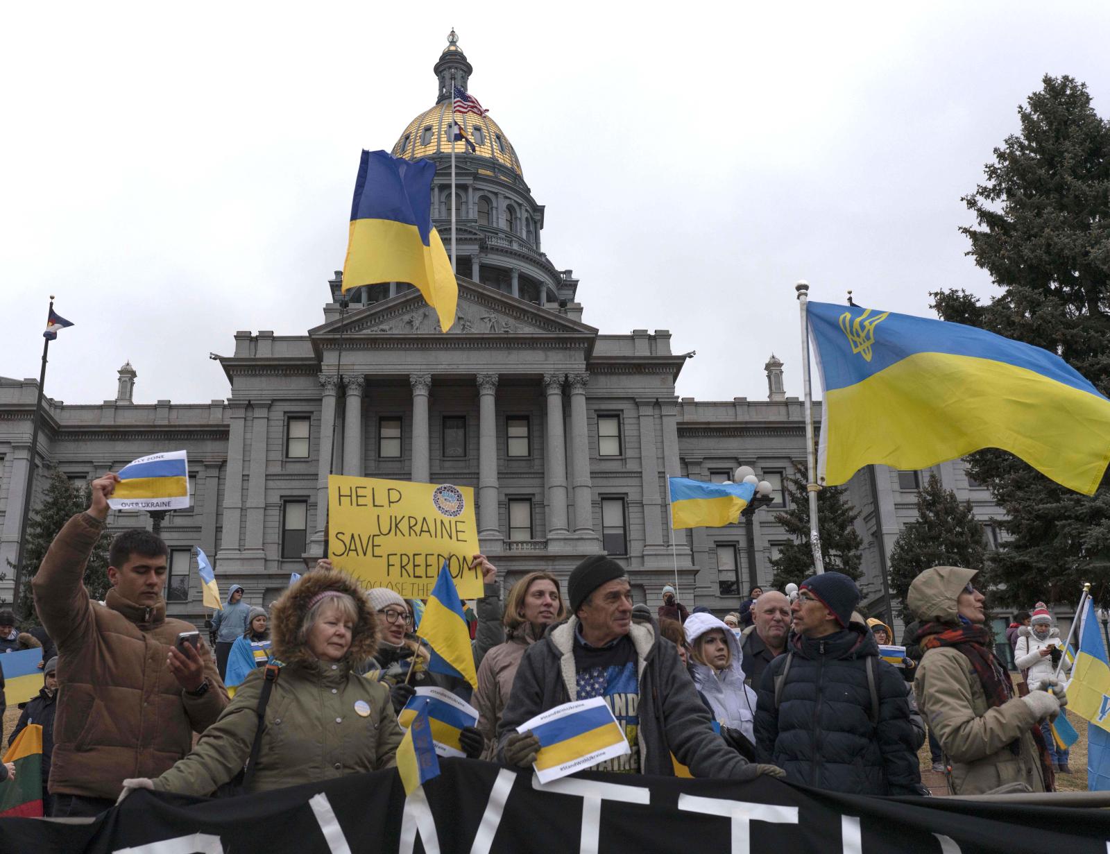 Protesters gather in front of t...ish a no-fly zone over Ukraine.