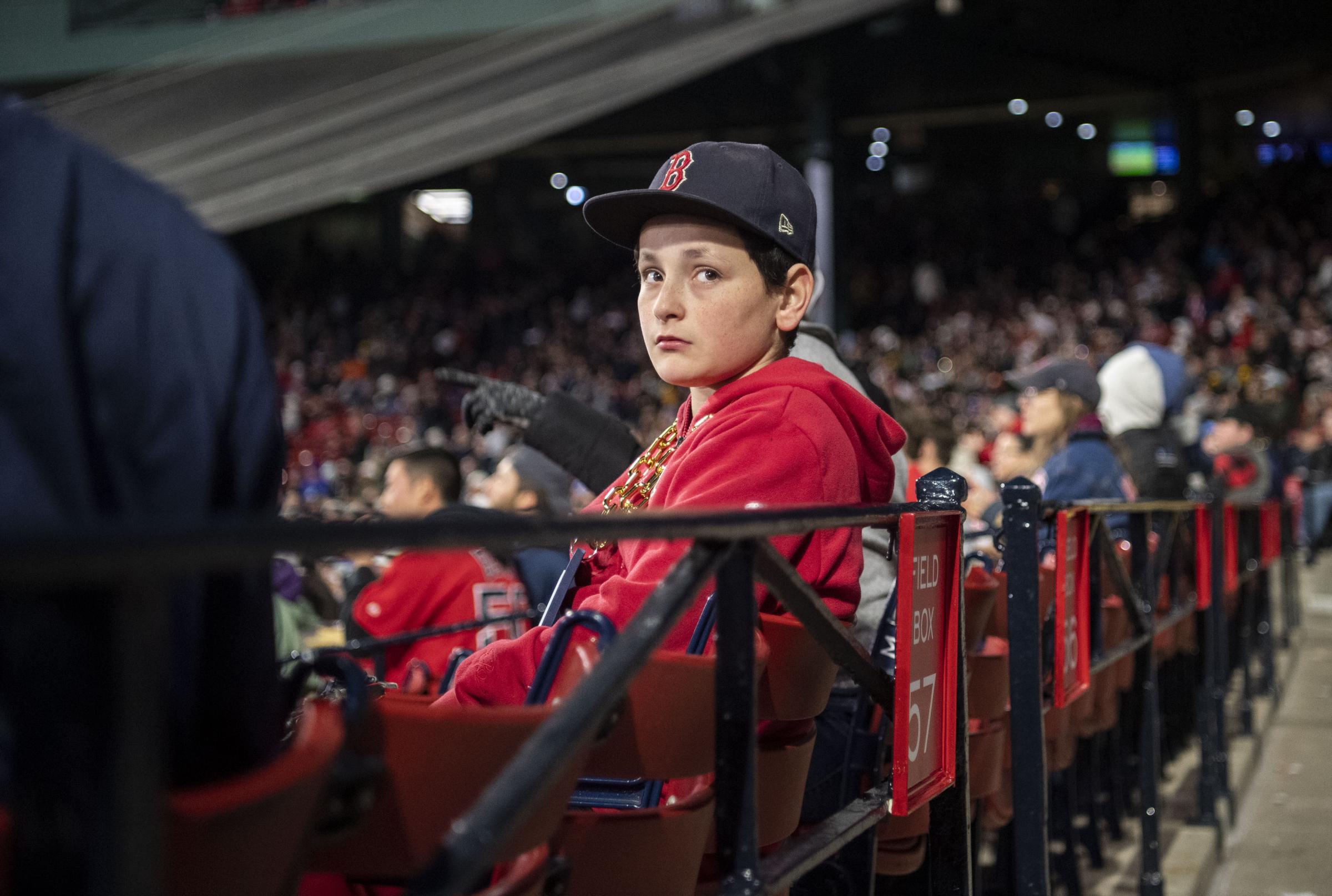 The 2023 Boston Red Sox  - April 3, 2023, Boston, MA: A young fan looks around...