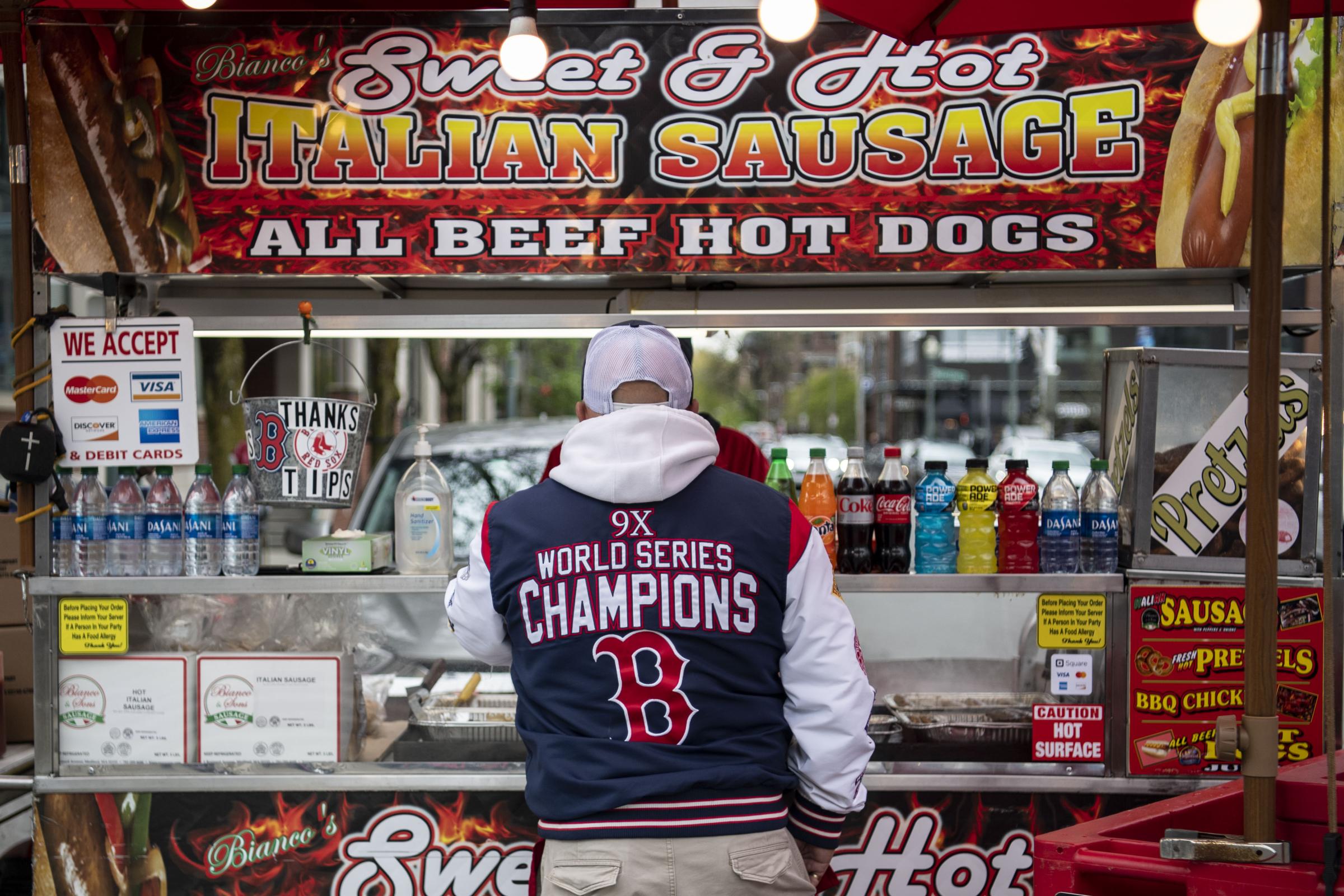 The 2023 Boston Red Sox  - May 4, 2023, Boston, MA: A fan orders food before a game...