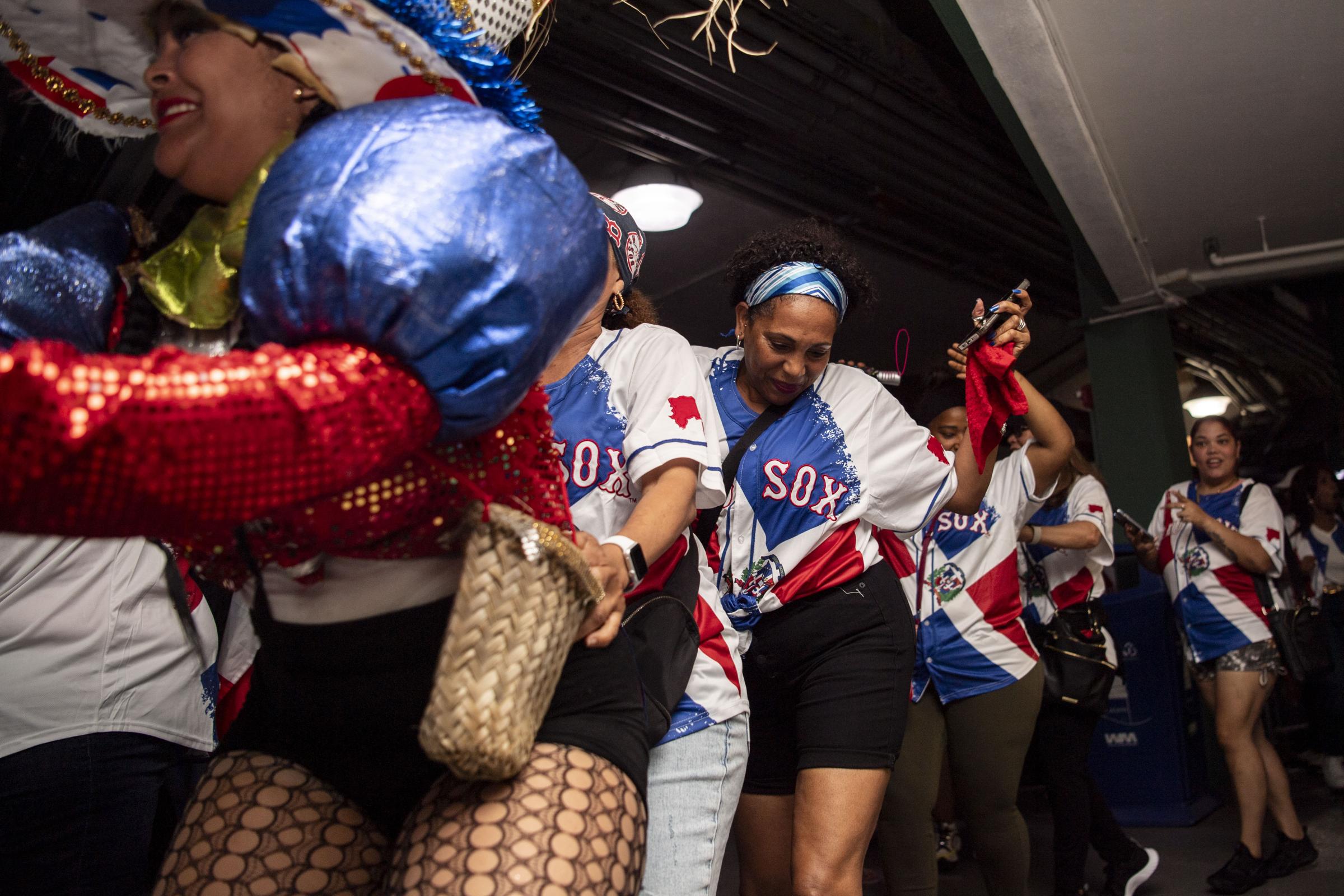 Fenway Park - August 10, 2023, Boston, MA:Fans celebrate Dominican...