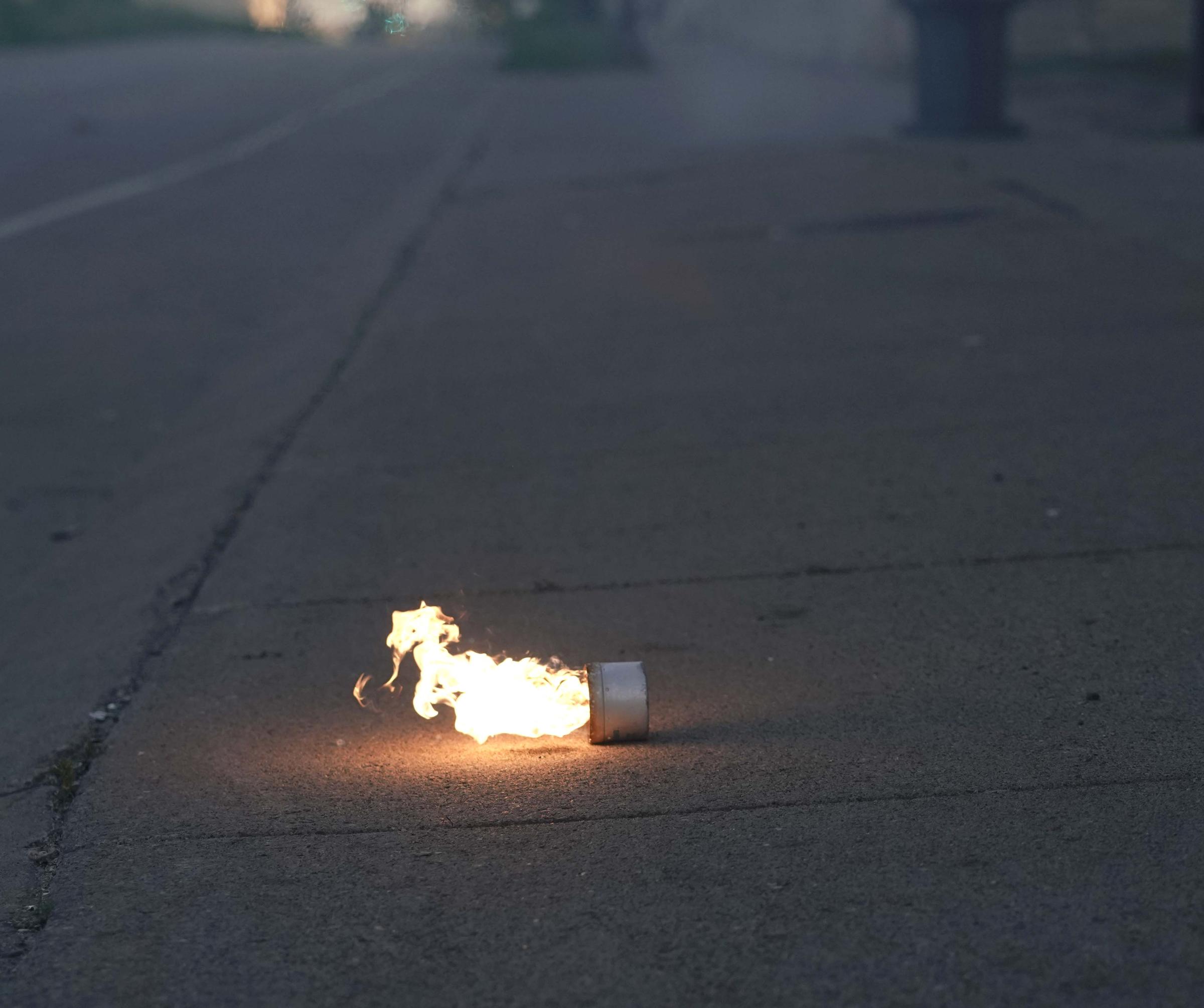 The BLM Summer - A tear gas canister expends on a sidewalk on Friday, May...