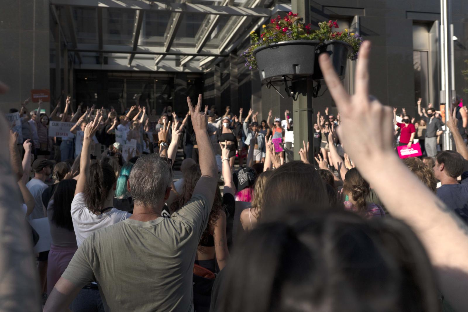 Protesters hold up two finger f...June 24, 2022, in Richmond. USA
