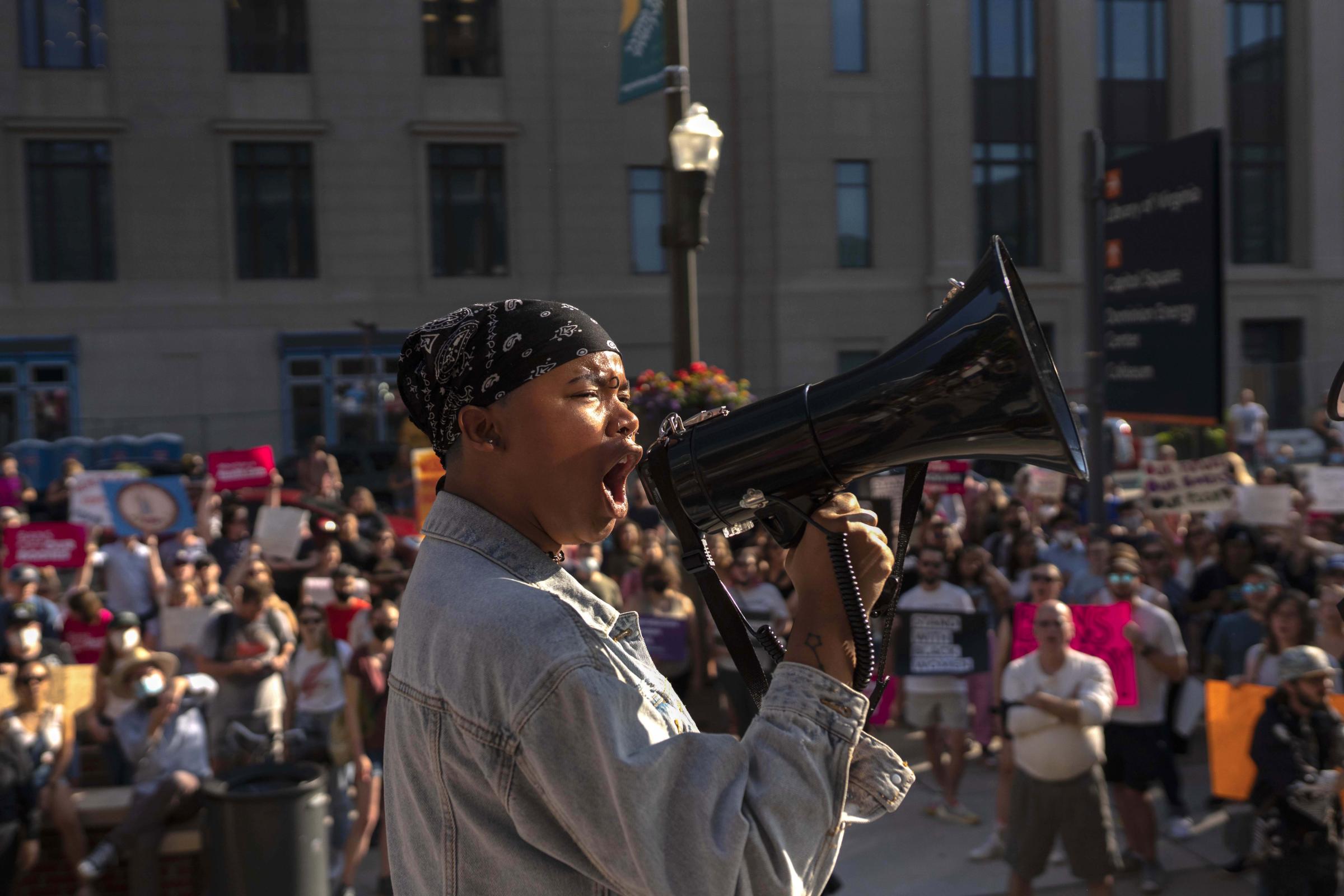 Roe v. Wade Decision  - A protester screams into a megaphone outside Richmond...