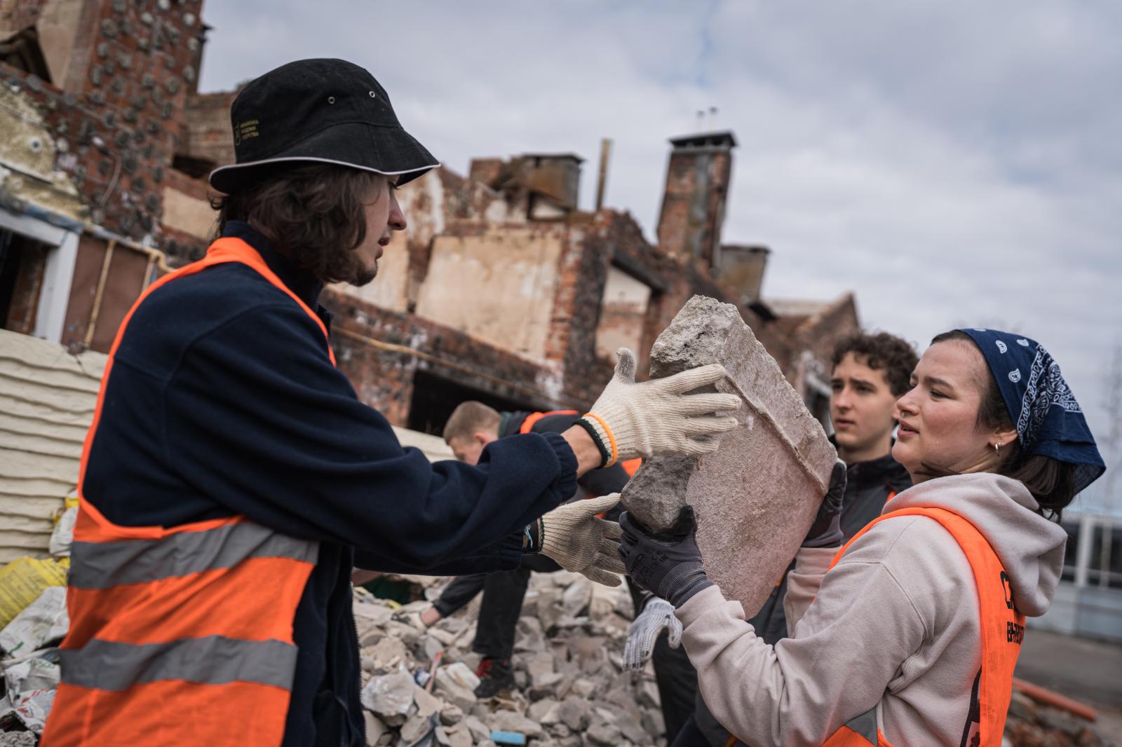 Ukraine: Second year of war - IRPIN, UKRAINE - MARCH 9: Brave to Rebuild volunteers help to dismantle the wreckage of homes and...