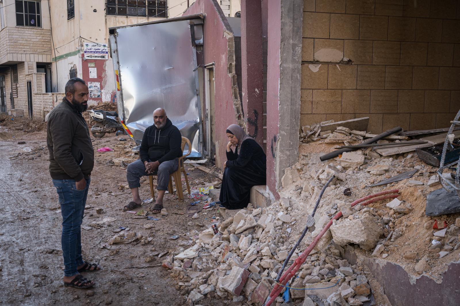 Israel, an announced war - JENIN, PALESTINE - DECEMBER 25: A family observes the damage to the basement of their home caused...