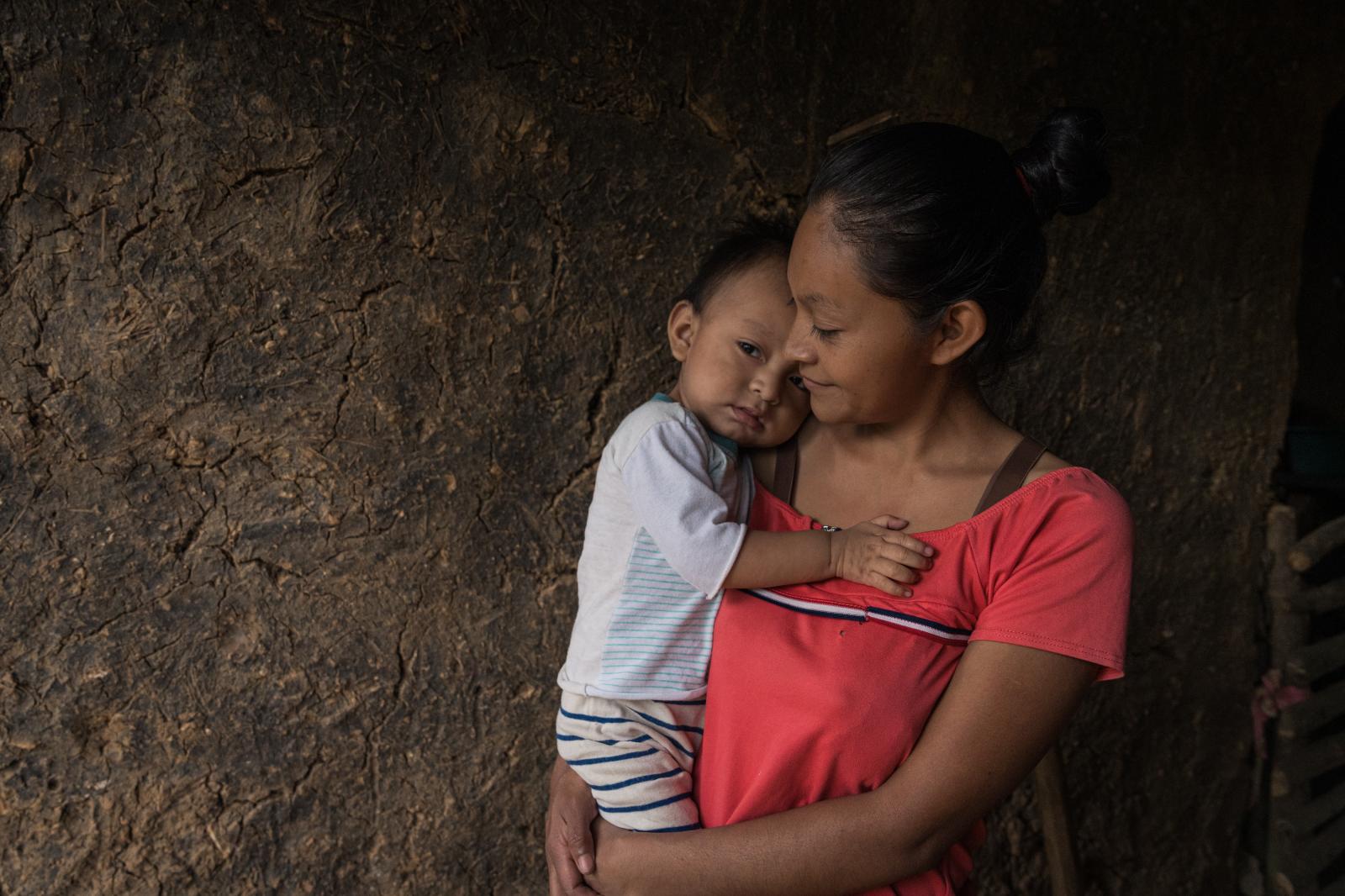 The Dry Corridor: How climate change causes mass migration from Central America - Mirna Lisenia Ram&iacute;rez (28) holds her 1-year-old son, Anderson Mois&eacute;s, who...