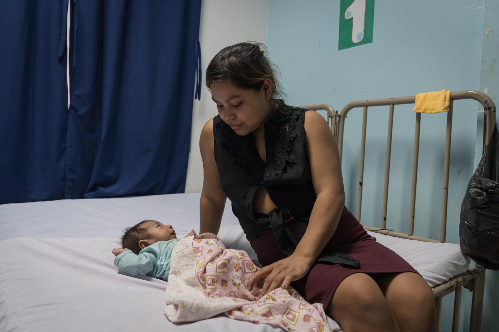 The Dry Corridor: How climate change causes mass migration from Central America - Antonia Garc&iacute;a (20) watches over her 2-month-old son, Elion Gael, who suffers from...