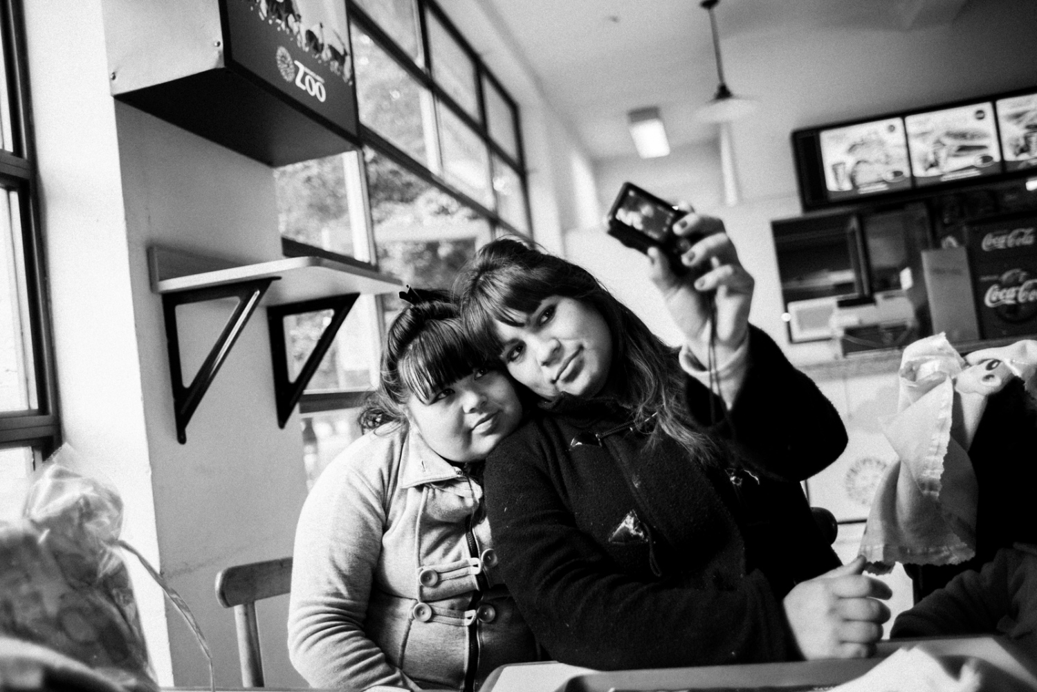 Just Mothers -  Stefi and Dai take a selfie at a diner. 