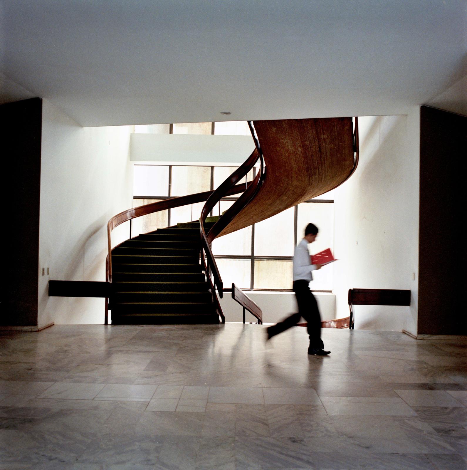 Staff roam the corridors of Itamaraty Palace. Designed by Brazilian architect Oscar Niemeyer and located in Brasilia, Brazil's capital, the...