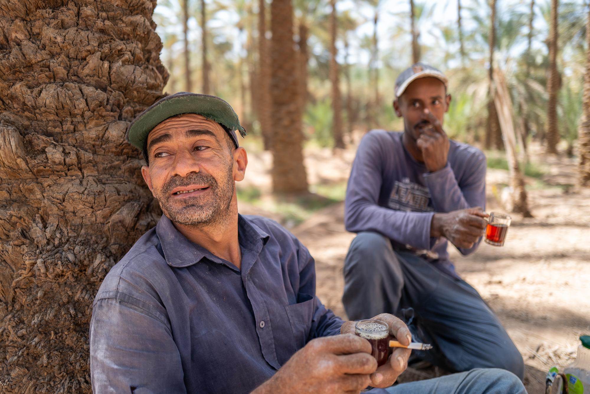 Saudi Arabia: Beyond The Petrol Wealth - Two date pickers on the private Zuayr date farm during a short break with tea.