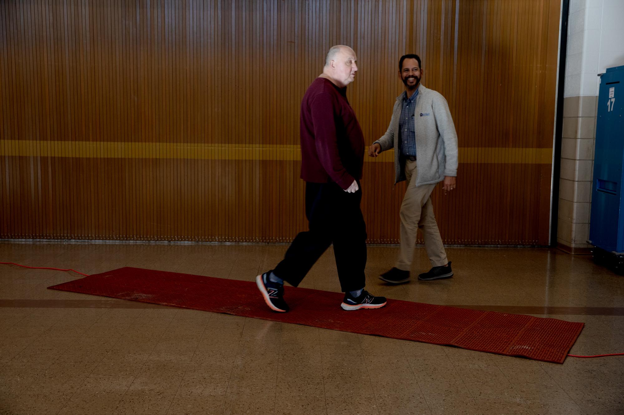 Recent Assignment - Larry, left, who refused to give his last name, walks out...