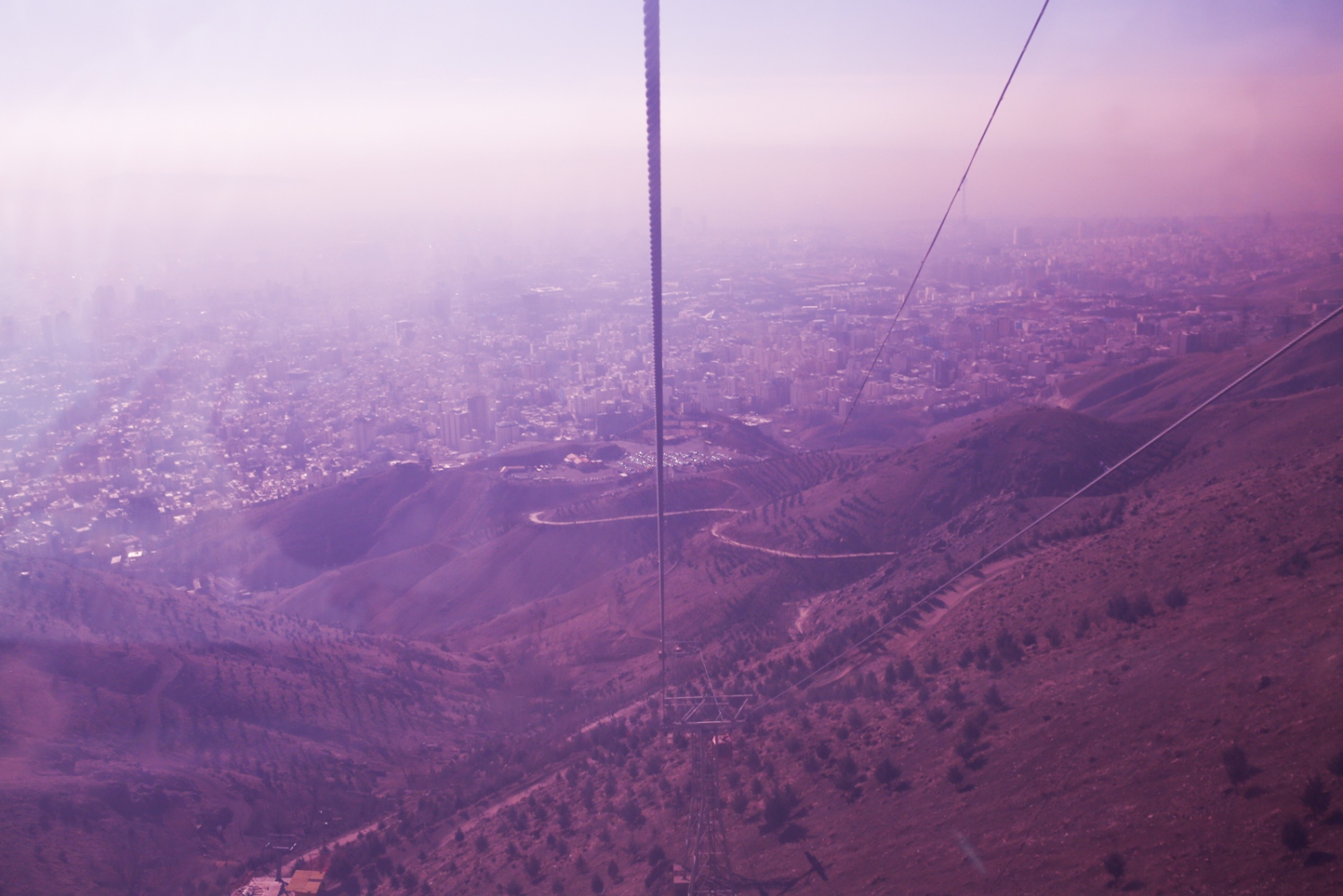  Tehran is seen from inside a cabin of the gondola lift that leads to the resort of Tochal. Alborz Mountains, North of Tehran. January 06, 2015 