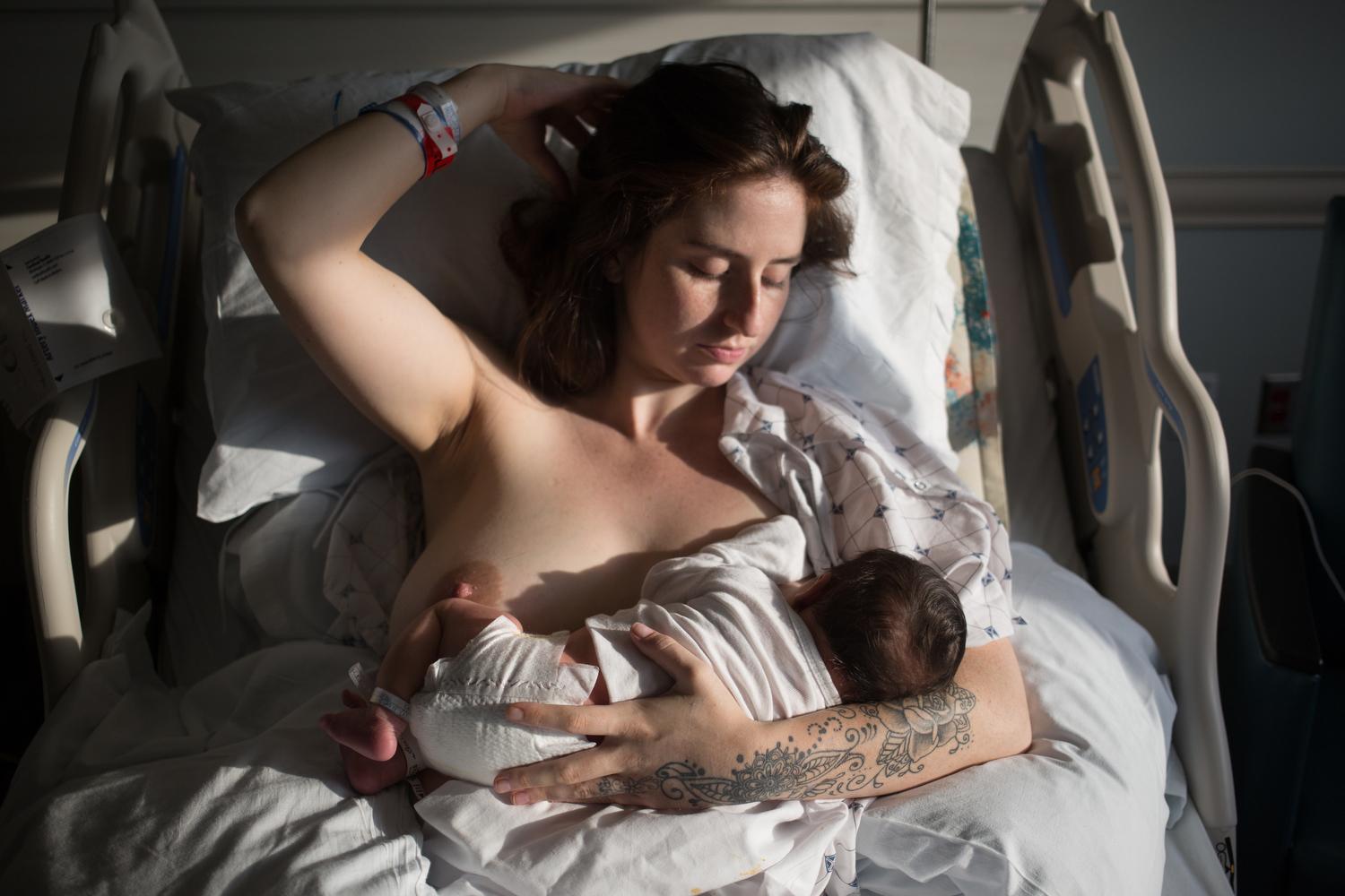 Image from Homepage - Eden breastfeeds Aaron. 