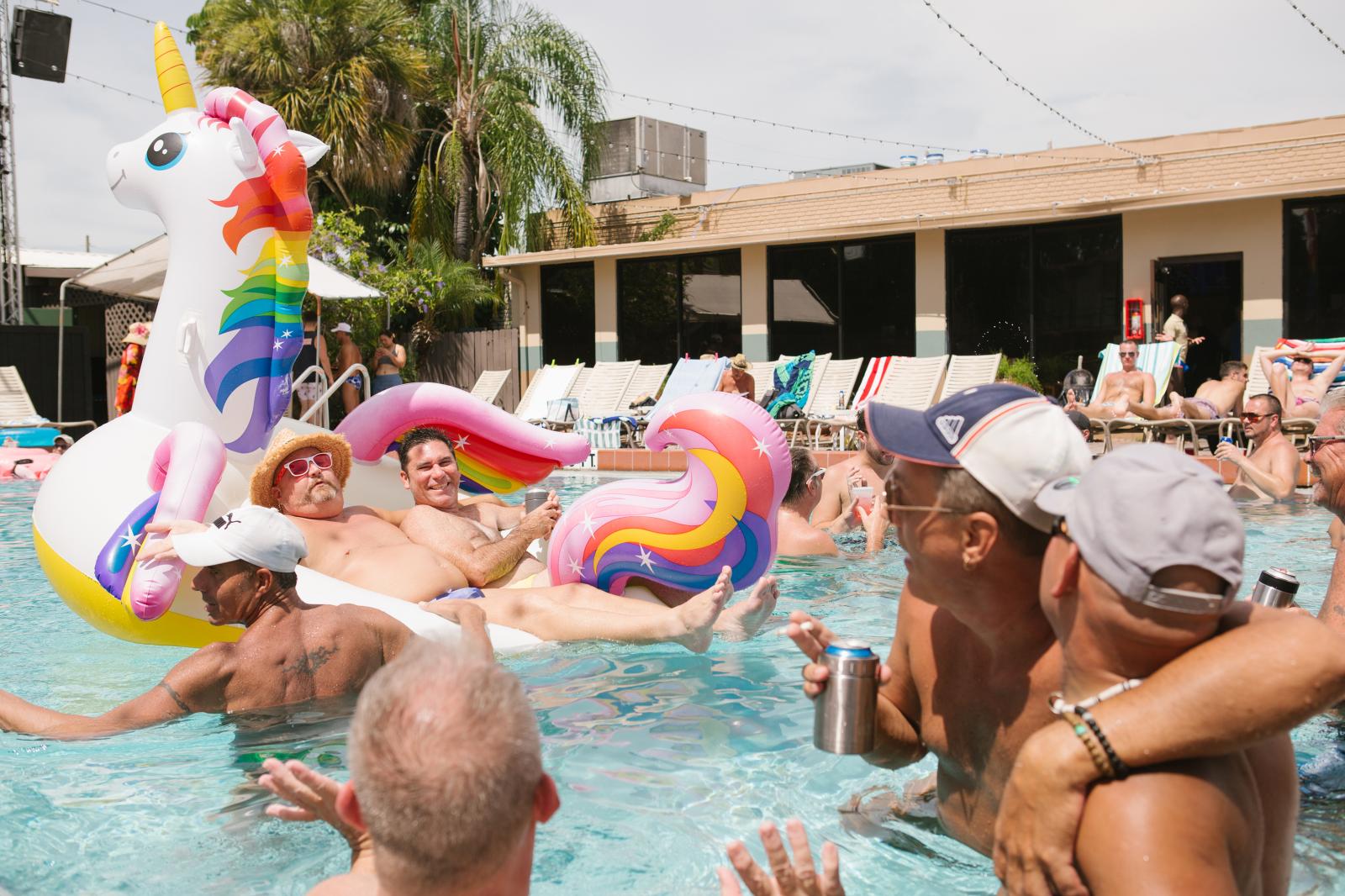 Men hang out at the pool during a party at Parliament House in Orlando, Florida. Parliament House is Orlando's iconic 44-year-old LGBTQ resort that includes several bars, hotel rooms, pool, nightclub and restaurant.