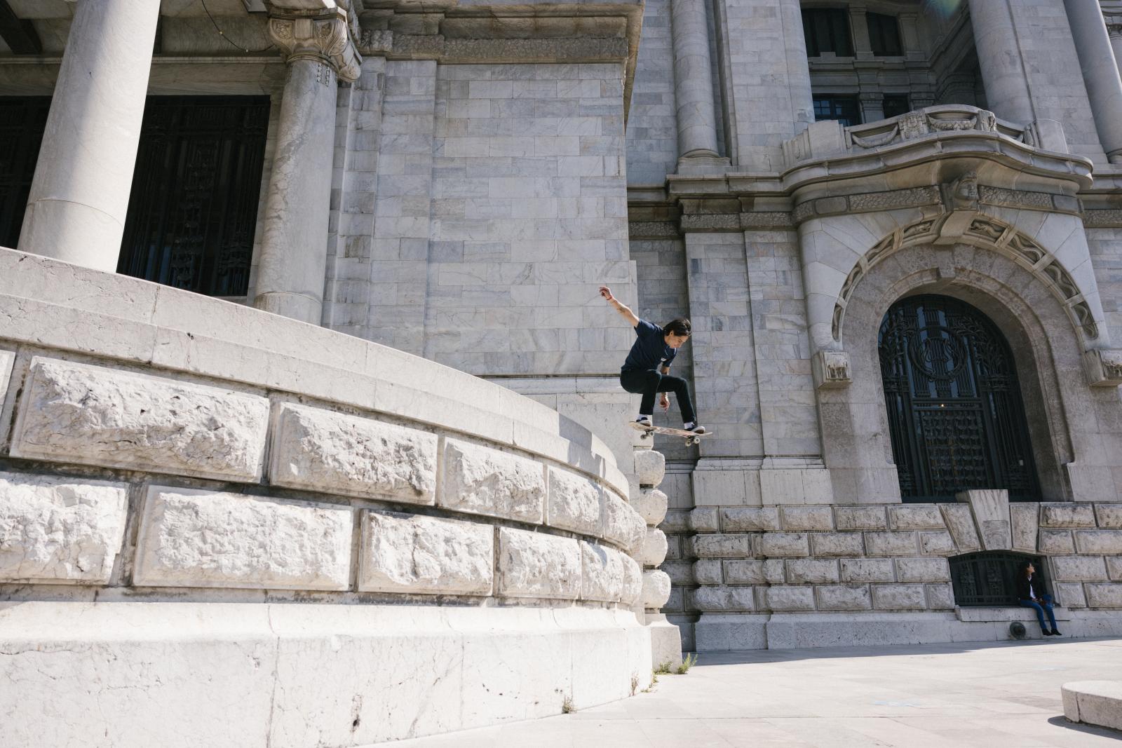 Mexico City, Mexico. January 9, 2021. Oscar Meza, a pro skateboarder and Olympic qualifier, does a trick at the Palacio de Bellas Artes in Mexico City, Mexico. CREDIT: Alicia Vera for The New York Times 