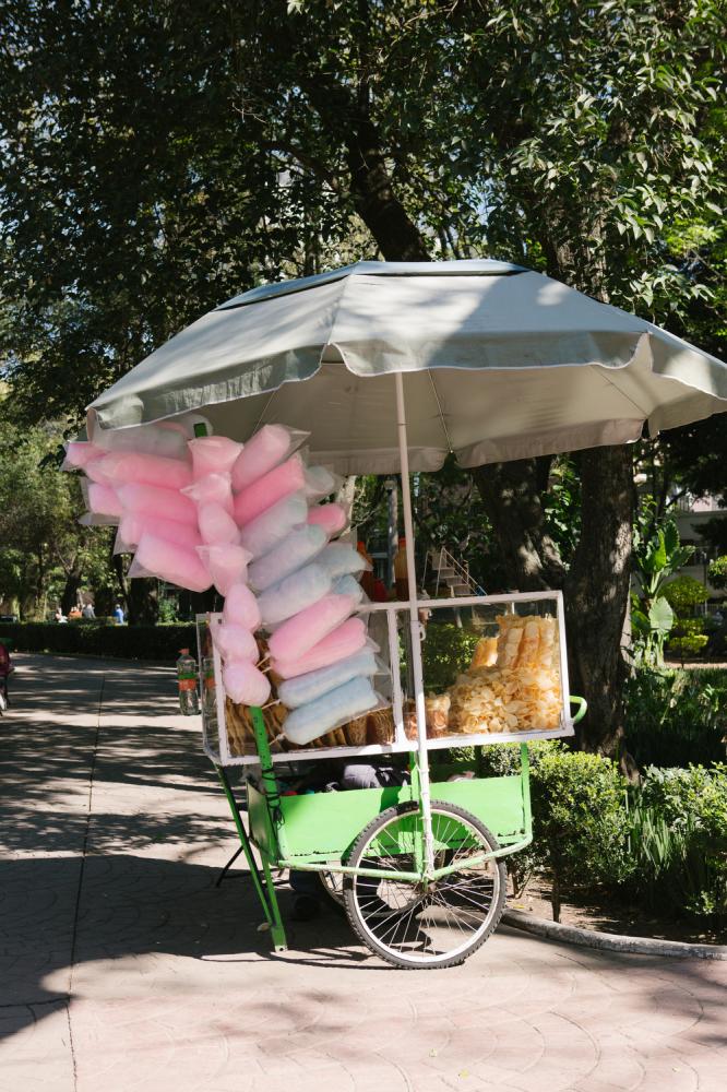 A cotton candy vendor in Parque Mexico in the Condesa neighborhood of Mexico City, Mexico. 