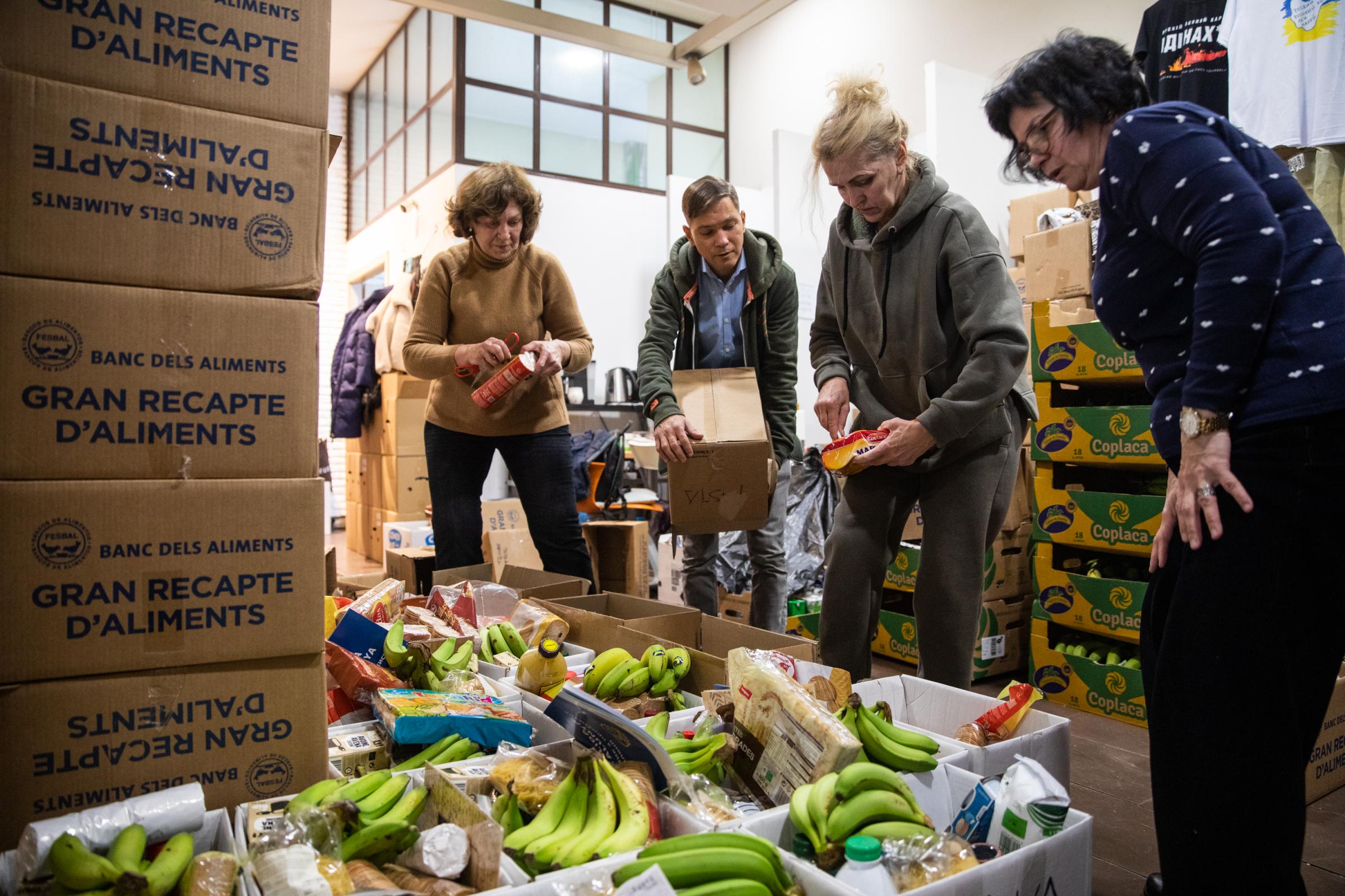 Ukrainian Refugee Association Collects Food And Basic Necessities - BARCELONA, SPAIN - FEBRUARY 09: Ukrainian volunteers sort...