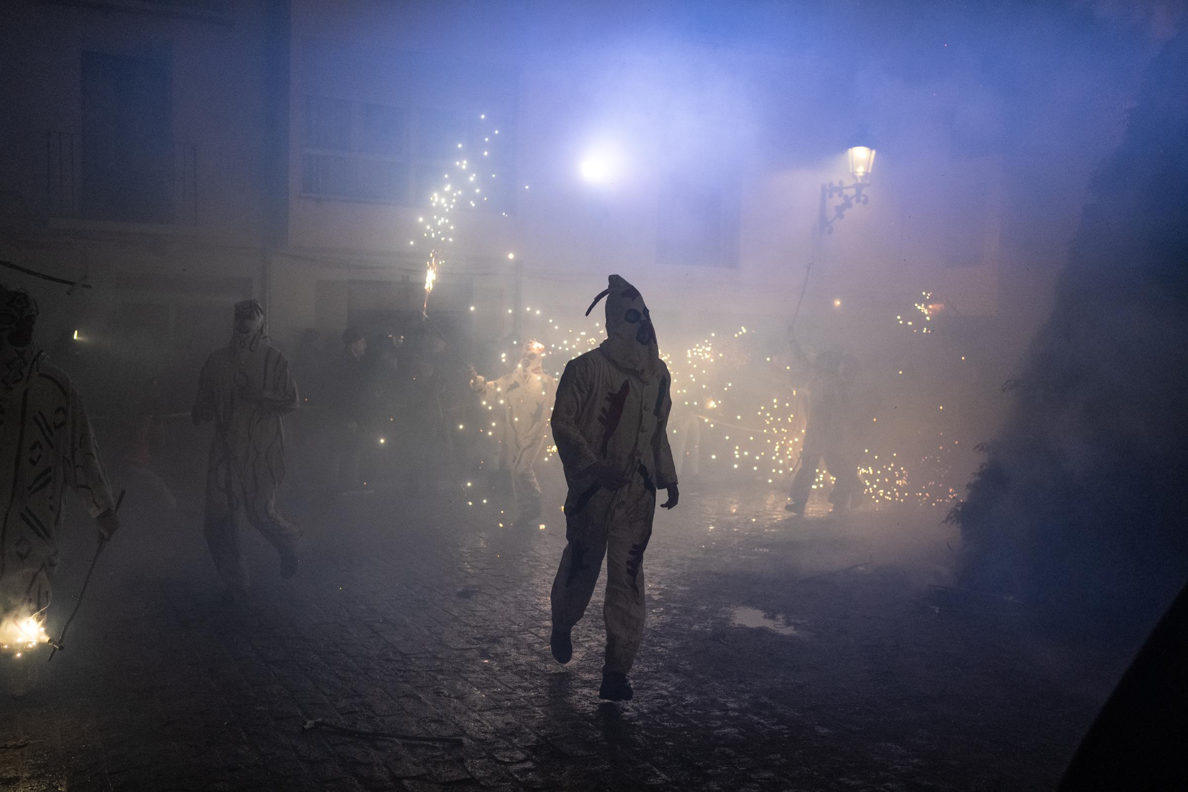 Spanish Villagers Celebrate The Santantona de Forcall, A Medieval Fire Festival - FORCALL, SPAIN - JANUARY 19: The demons set up a small...