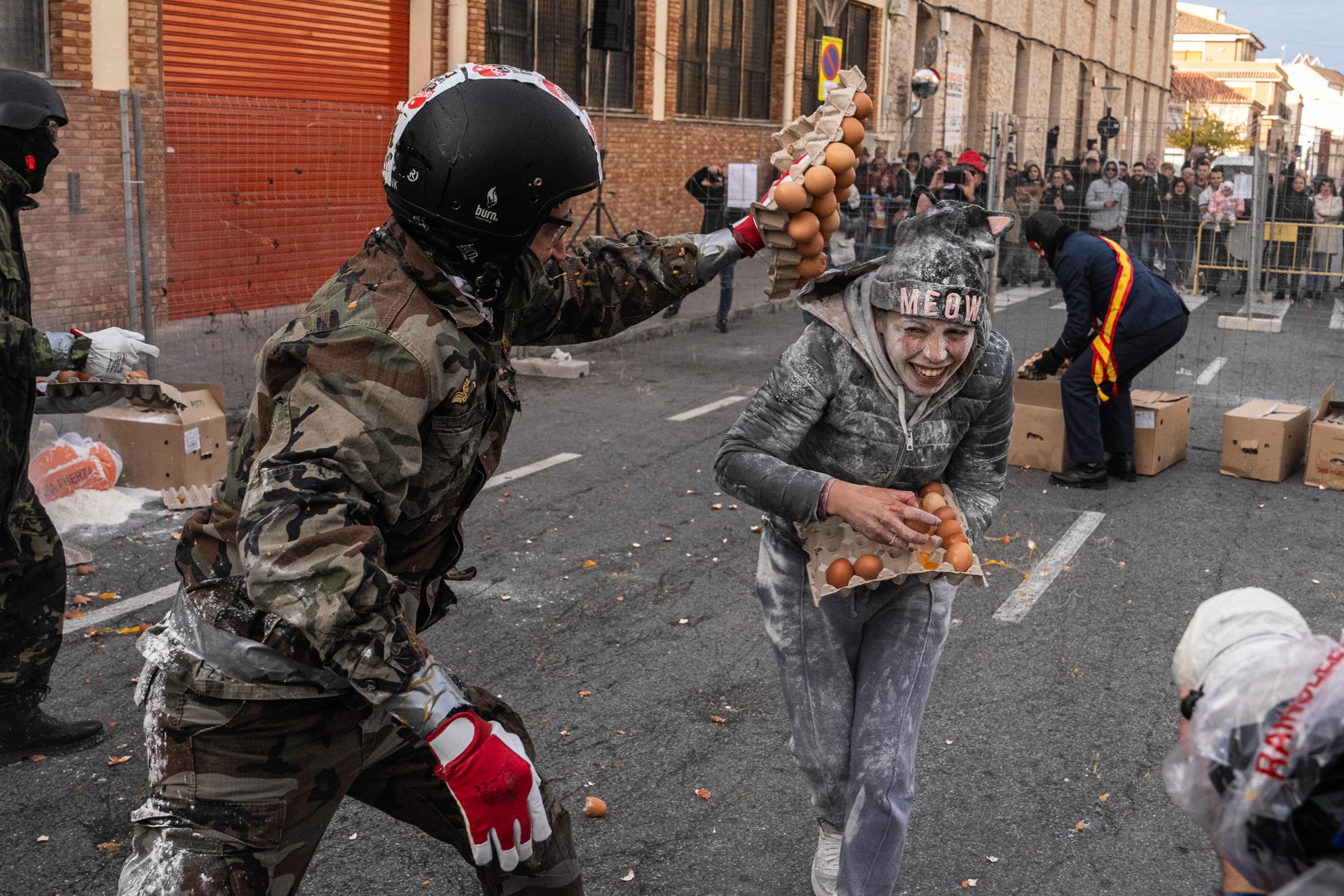 Spain's Annual Els Enfarinats Food Battle - ALICANTE, SPAIN - DECEMBER 28: Revelers take part in the...