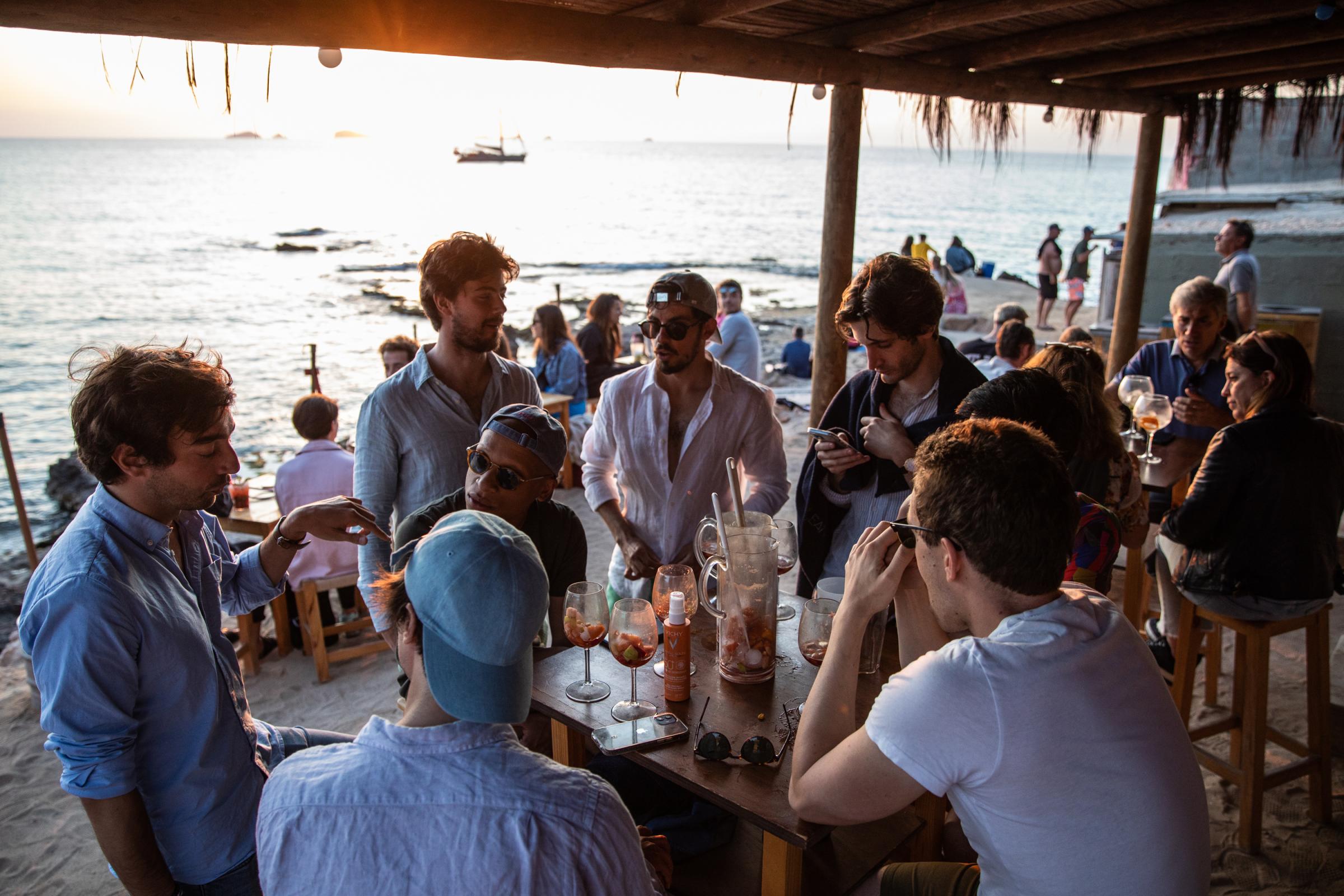 Grand Opening At Pacha Ibiza Heralds A Pre-Pandemic Party Season - French tourists enjoy the sunset at cala Escondida...