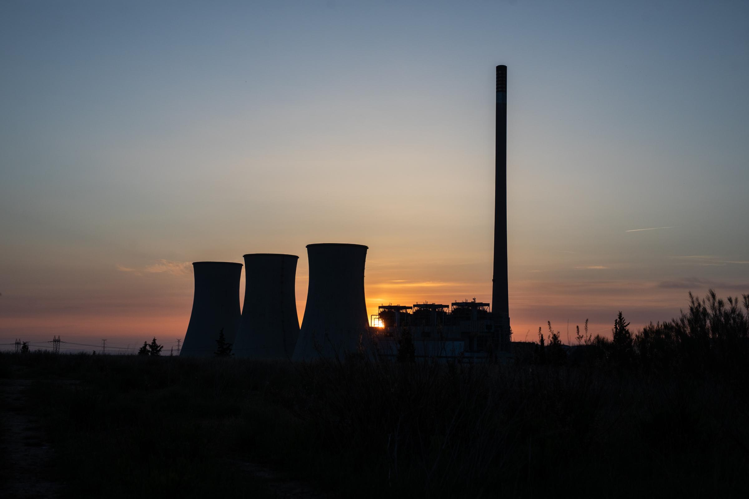 ANDORRA, SPAIN - MAY 13: Sunrise at the thermal power plant on 13 May 2022 in Andorra, Teruel, Spain. The three identical towers of the Teruel...