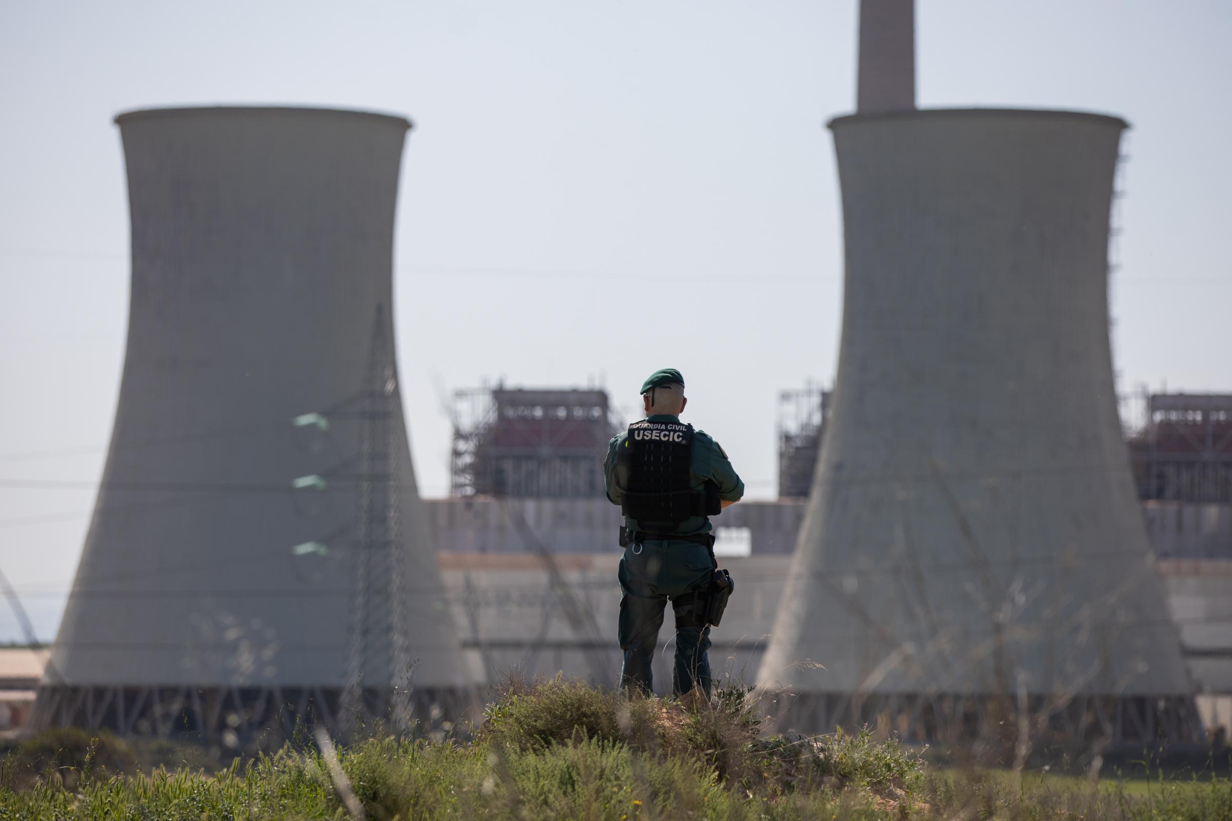 Demolition Of Andorra's Thermal Power Plants - ANDORRA, SPAIN - MAY 13: A civil guard watches that no...