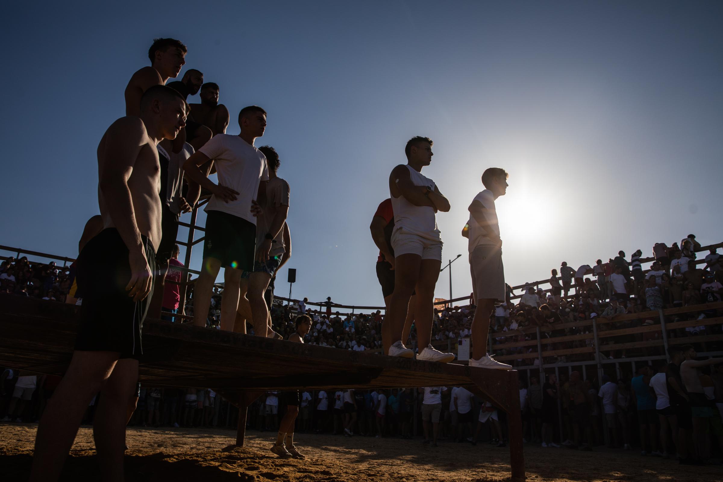 At 'Bous A La Mar', Revelers Take Plunge To Dodge Bulls And Beat The Heat - DENIA, SPAIN - JULY 17: Participants waiting for a bull...