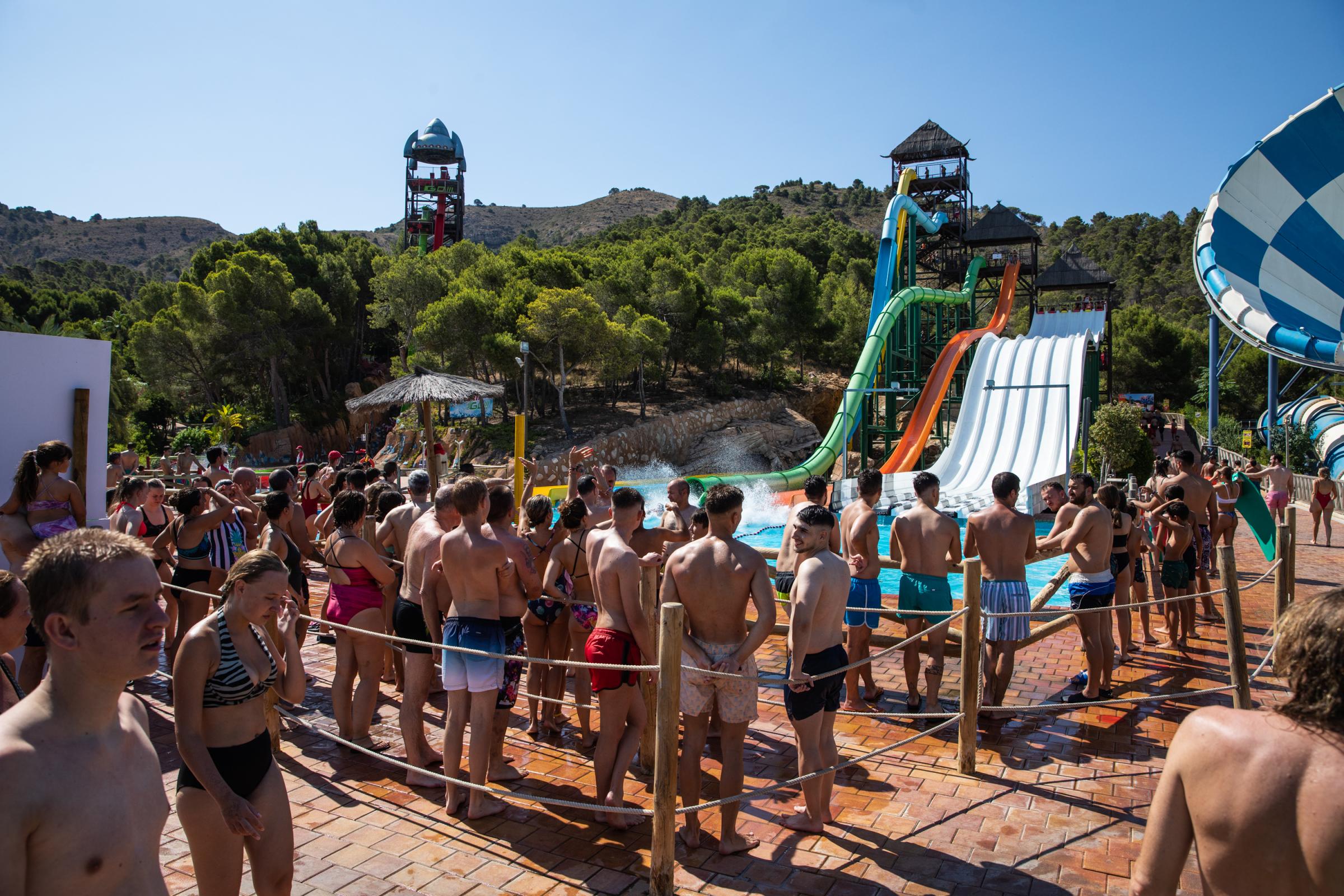 Heatwave Sweeps Across Spain - BENIDORM, SPAIN - JULY 16: Tourists queue up to ride the...