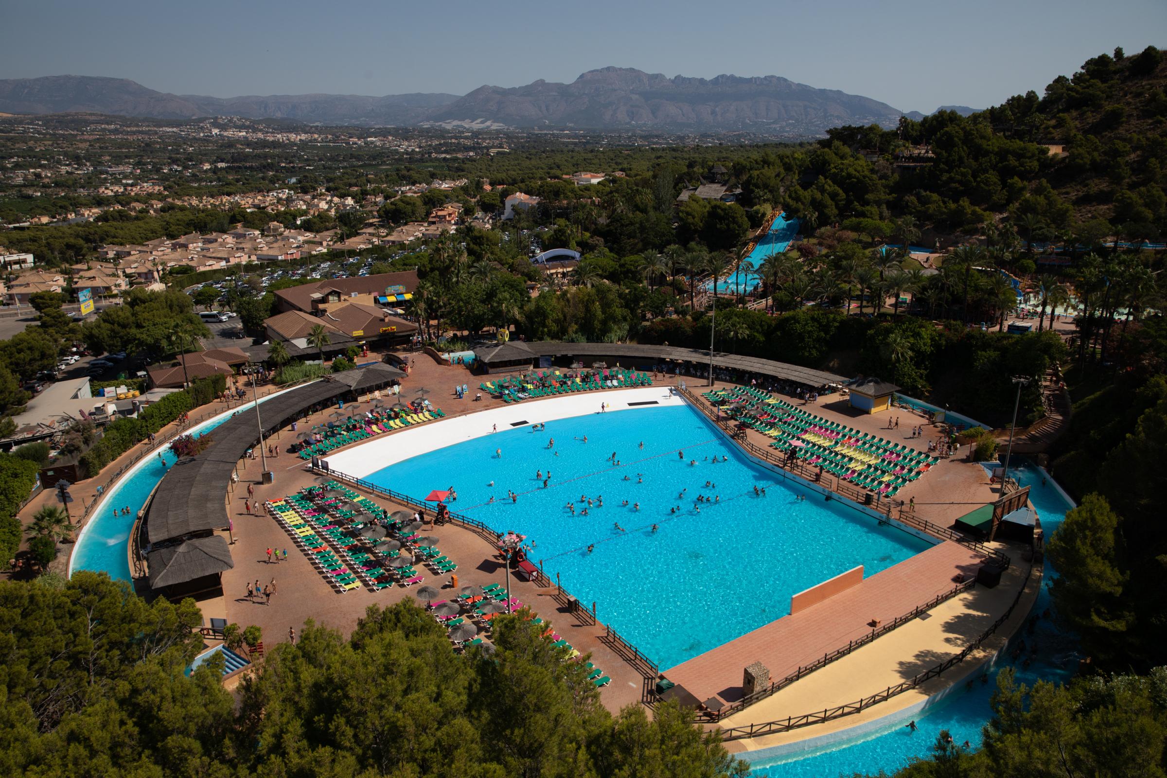 Heatwave Sweeps Across Spain - BENIDORM, SPAIN - JULY 16: Tourists enjoy the wave pool...