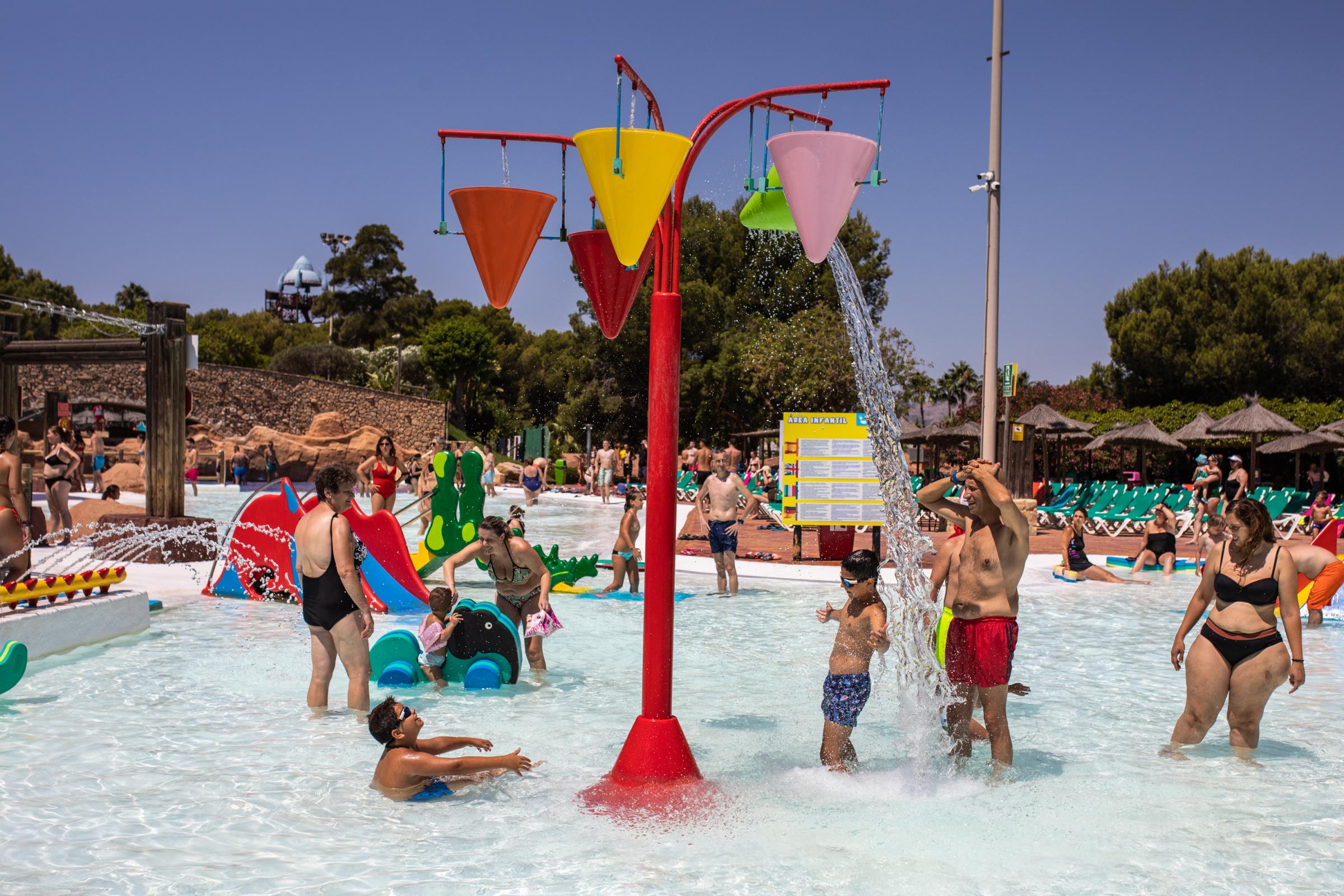Heatwave Sweeps Across Spain - BENIDORM, SPAIN - JULY 16: Tourists enjoy themselves at...