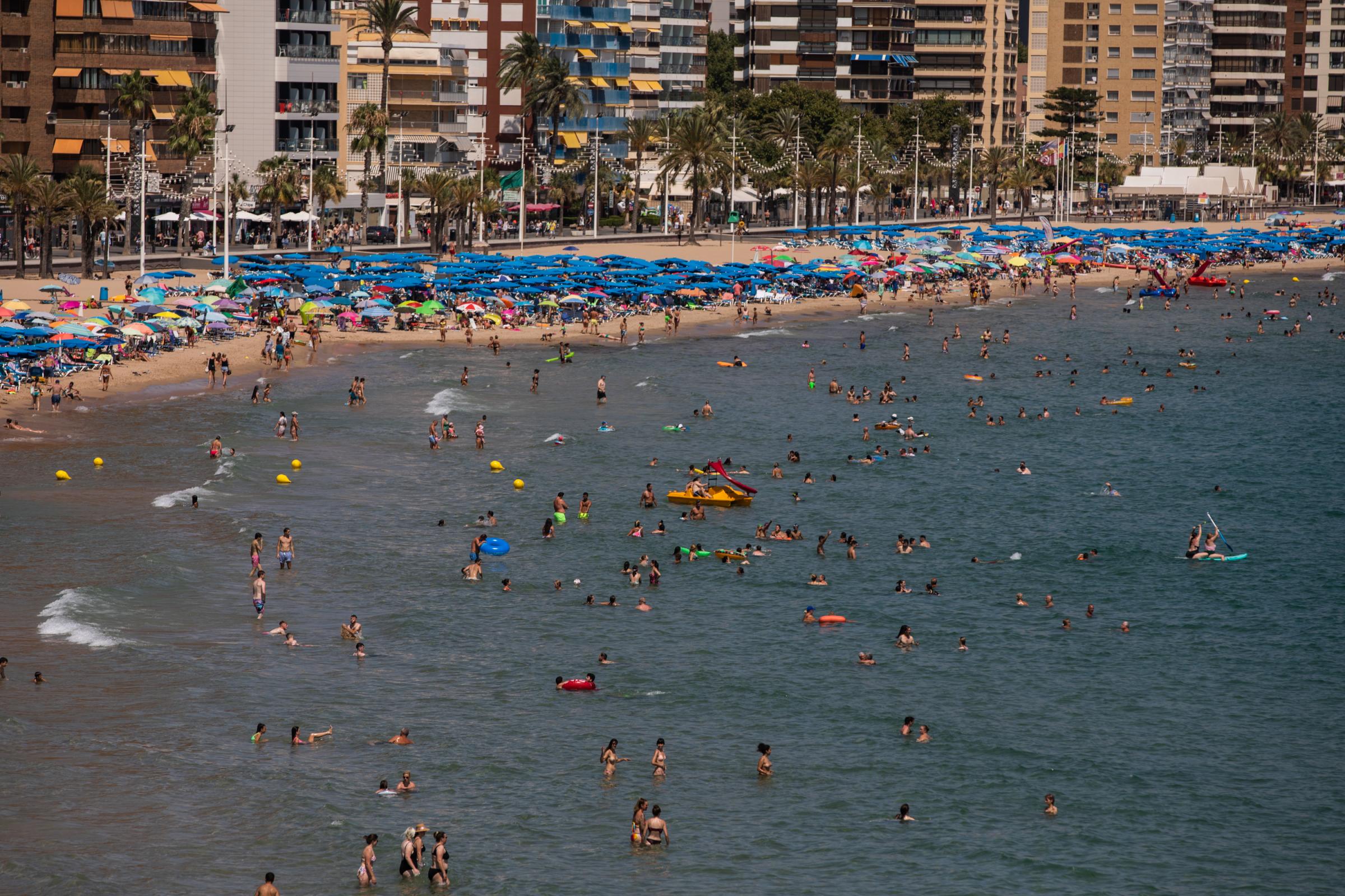 Heatwave Sweeps Across Spain - BENIDORM, SPAIN - JULY 16: Tourists fill the Levante...