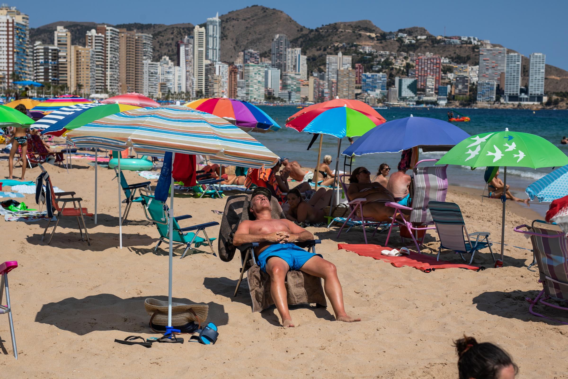 Heatwave Sweeps Across Spain - BENIDORM, SPAIN - JULY 16: Tourists fill the Levante...