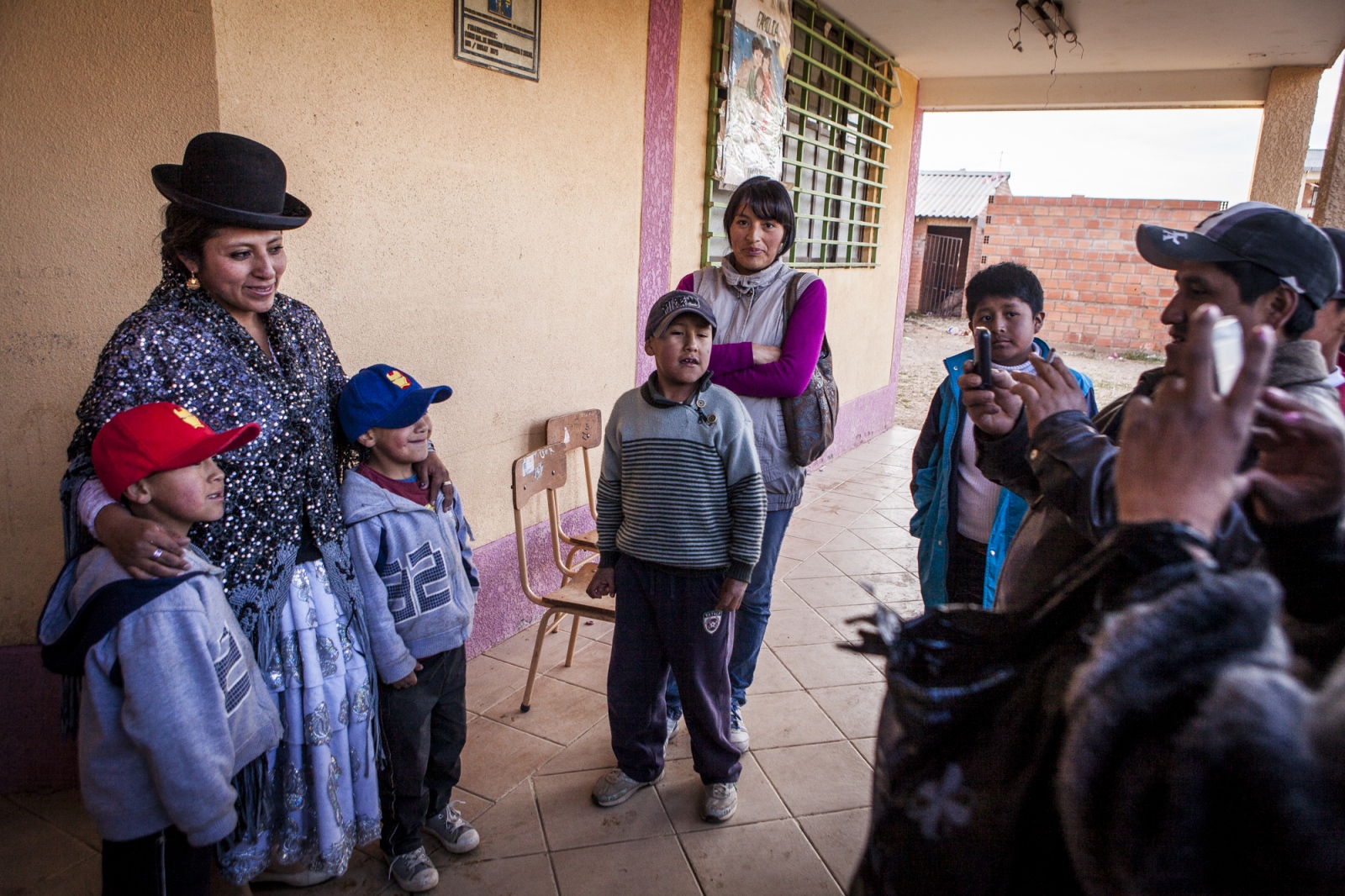  Juanita La Carinosa takes photos with young fans after the exhibition fight in Senkata, El Alto....