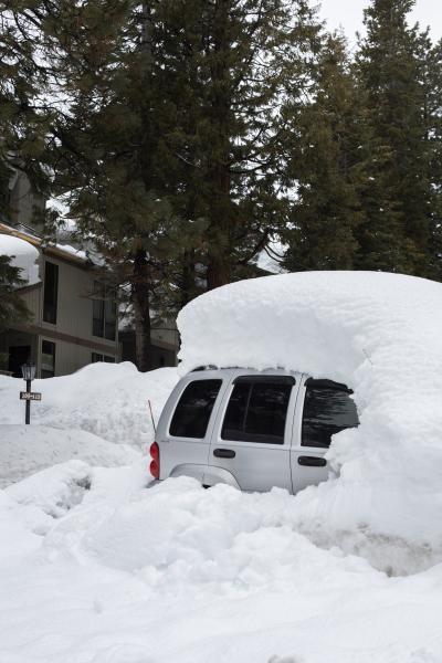 Car Covered in Snow in Lake Tahoe Region | Buy this image