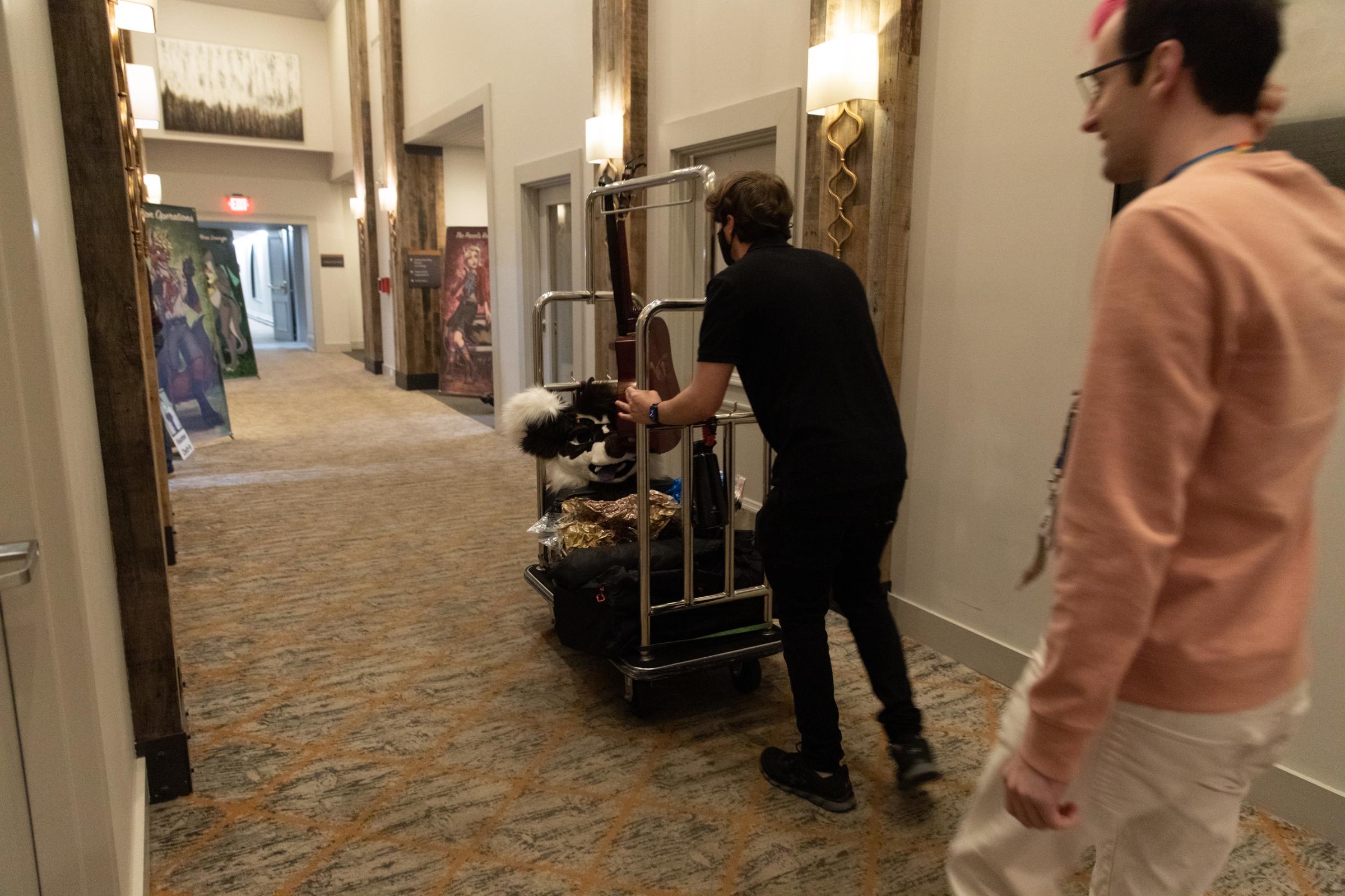 Furry Fandom - Attendees check in to the hotel with fursuits in tow.