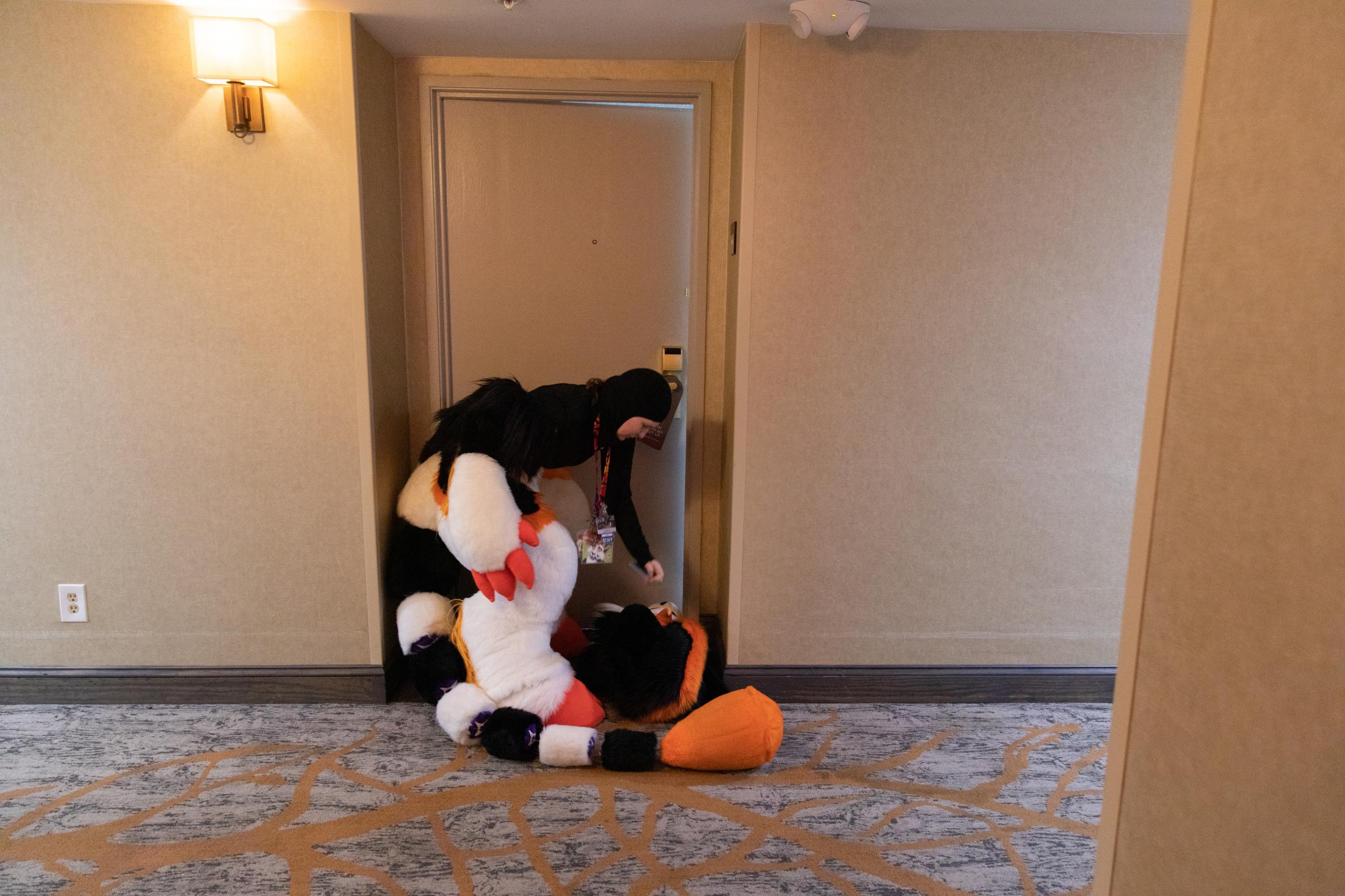 Furry Fandom - Lyra Feeney heads to her hotel room to relax out of costume after the parade.
