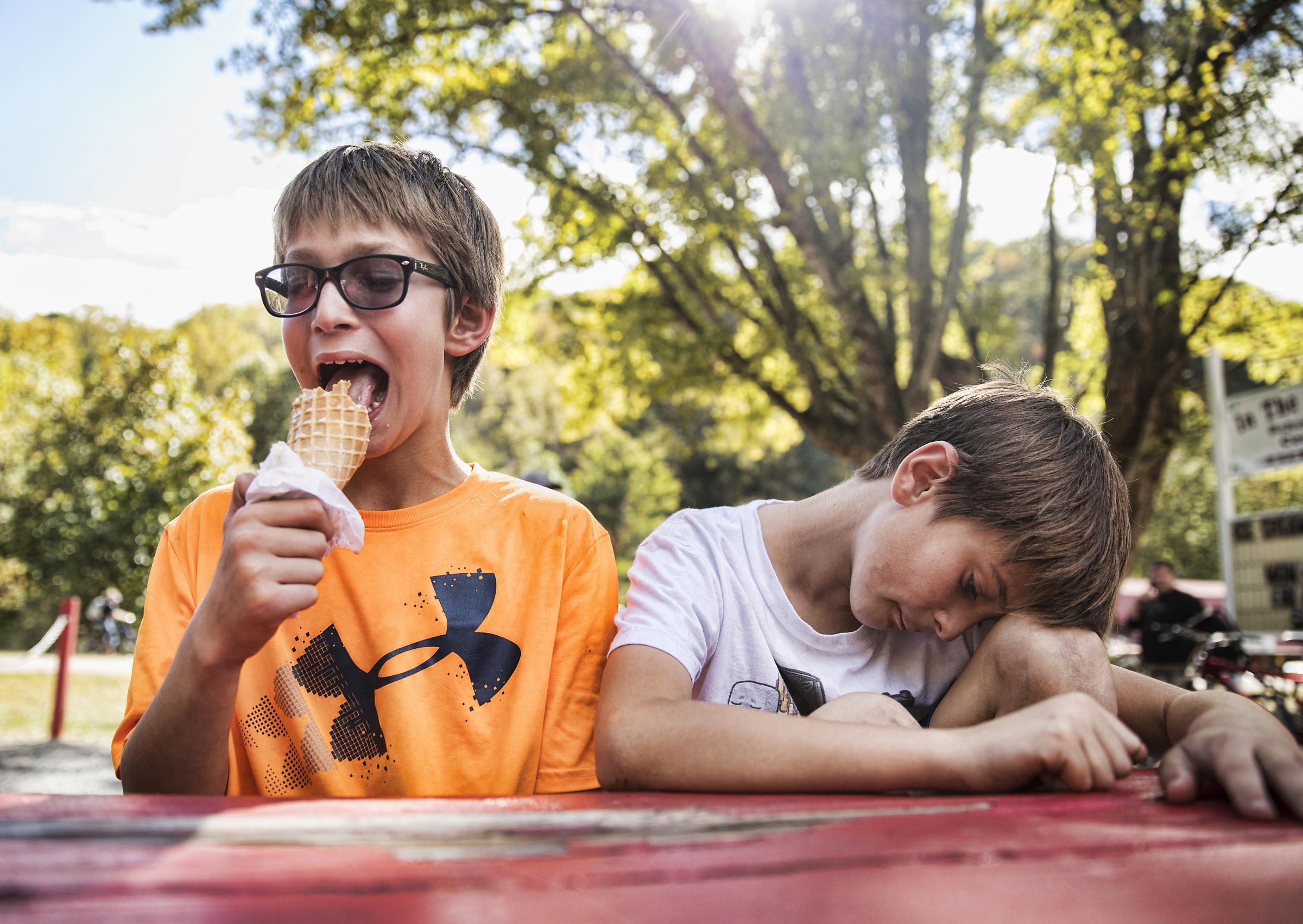 Growing Up - A boy enjoys a snack at Off the Beaten Path Ice Cream...