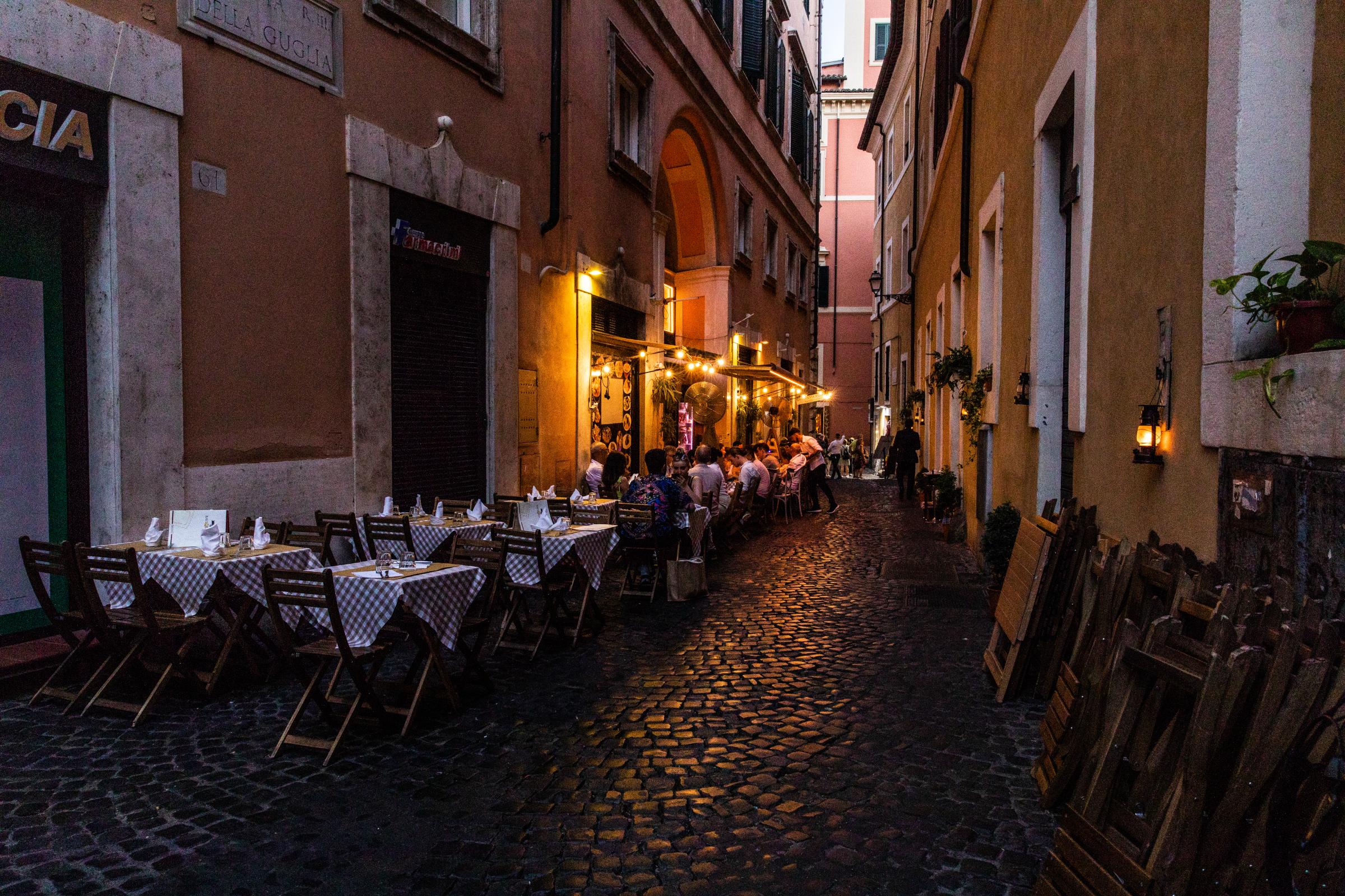 That Bad Boy Rome - A First-timer's Perspective - As the sun sets, lights come on for the many restaurants scattered along the side streets of Rome.