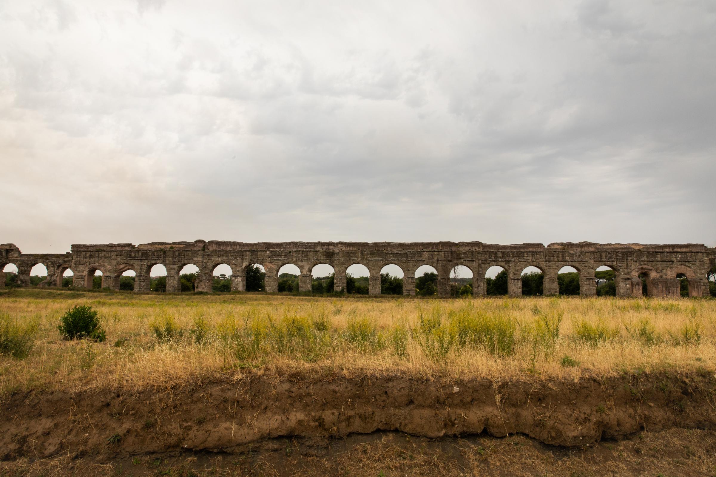 That Bad Boy Rome - A First-timer's Perspective - A portion of the ancient Roman aqueducts still stands. The aqueducts were used to move water from...