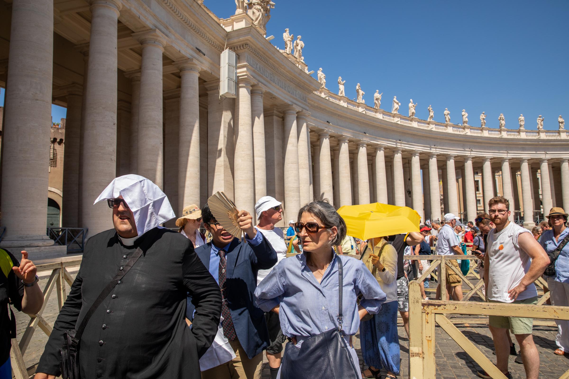 That Bad Boy Rome - A First-timer's Perspective - A priest visiting St. Peter&#39;s Basilica used a napkin for shade while waiting in line as...
