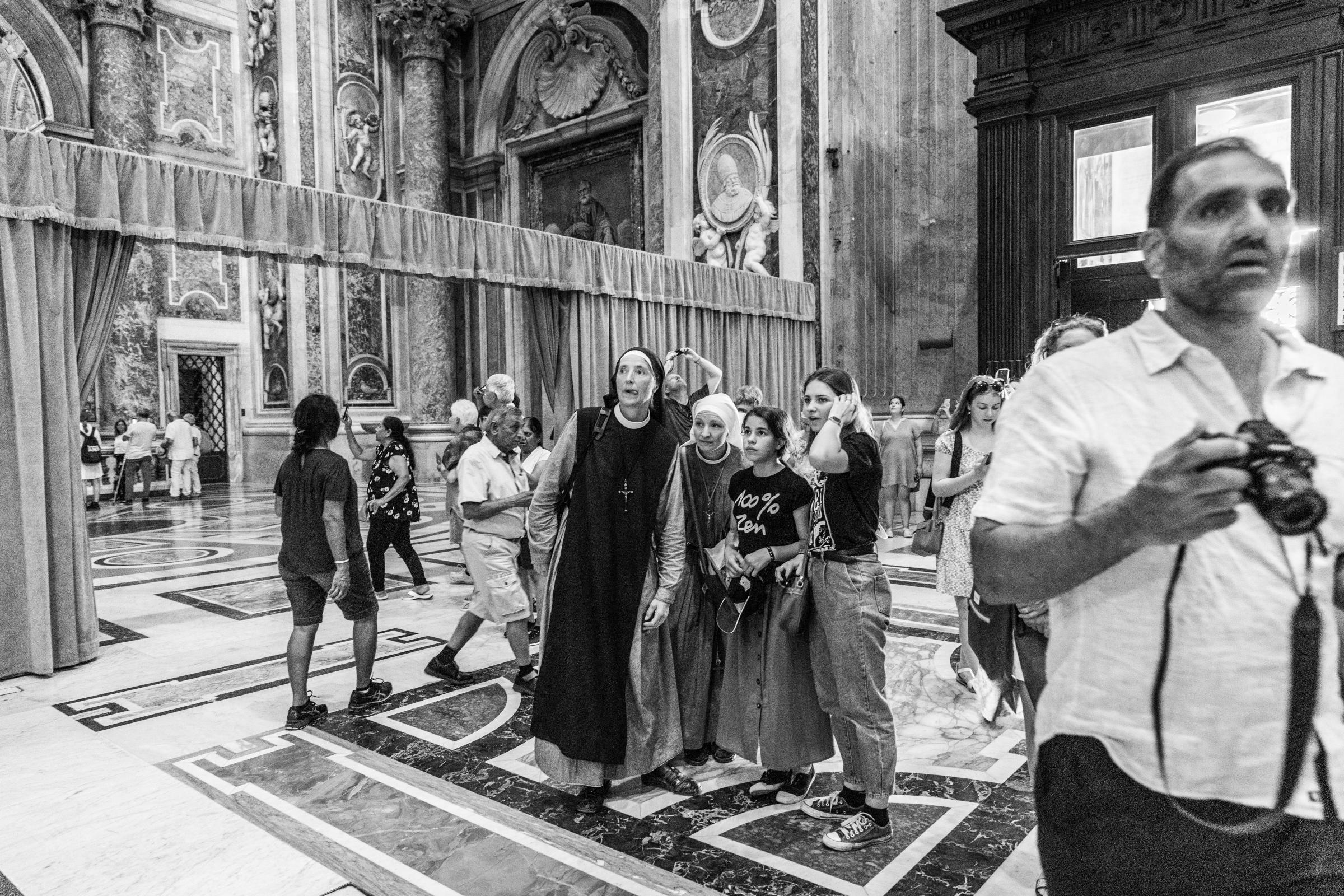That Bad Boy Rome - A First-timer's Perspective - A young nun looks in awe as she steps into the chapel at St. Peter&#39;s Basilica.