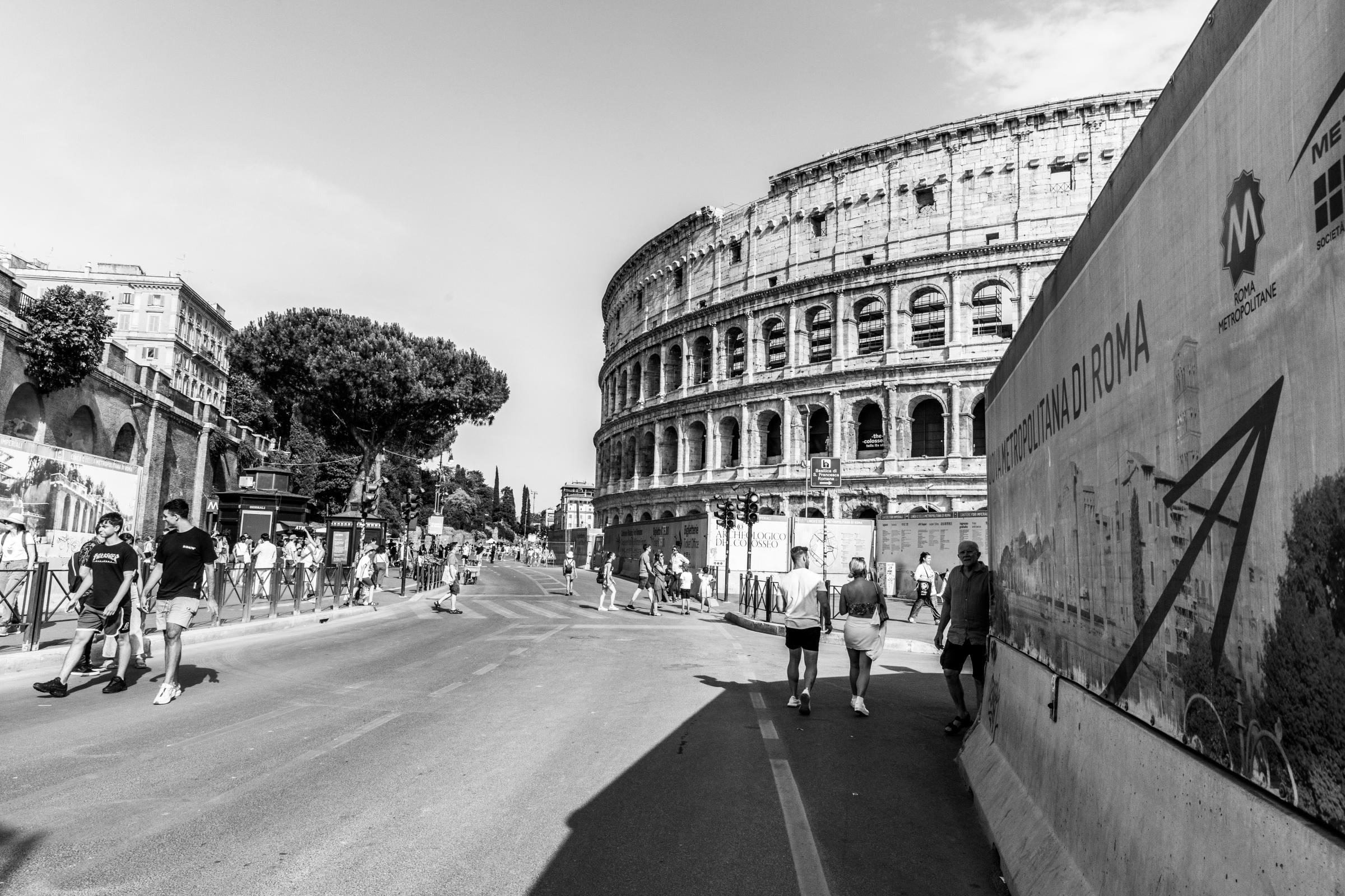 That Bad Boy Rome - A First-timer's Perspective - Visitors walk toward the Colosseum in Rome.